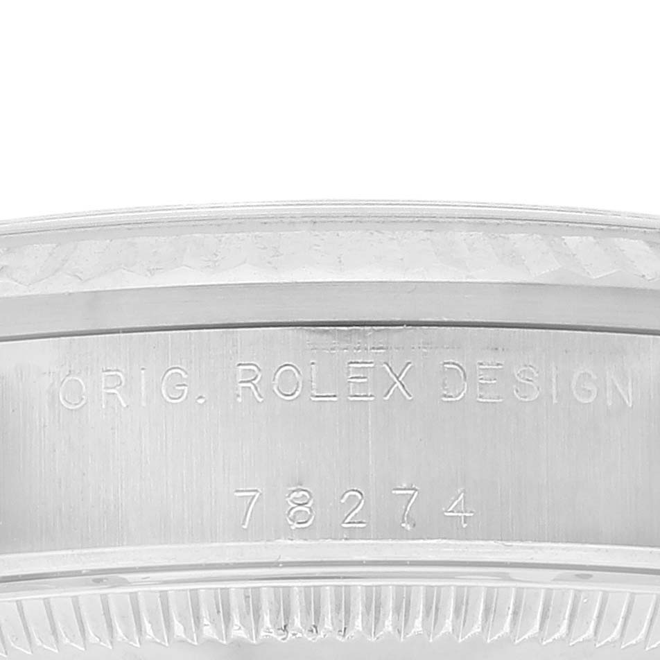 The image shows an up-close view of the case side of the Rolex Mid-Size 78274 Women
s Stainless Steel Silver Dial 78274 Women
s Stainless Steel Silver Dial model, featuring the model number "78274" engraved.