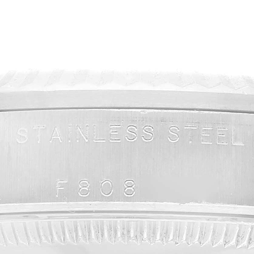 This image shows a macro view of the stainless steel engraving and the bezel of a Rolex Mid-Size 78274 Women
s Stainless Steel Silver Dial 78274 Women
s Stainless Steel Silver Dial model watch.