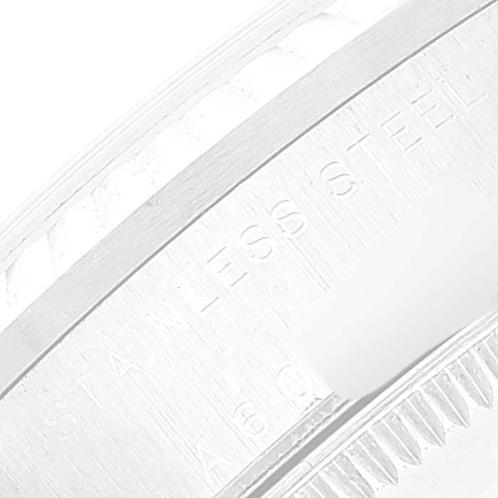 The image shows a close-up of the watch case between the bezel and caseback on a Rolex Datejust 78274 Women's Stainless Steel Black Dial 78274 Women's Stainless Steel Black Dial, revealing "STAINLESS STEEL" engraving.