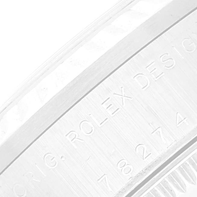 This close-up image shows an engraving on the side of the casing of a Rolex Datejust 78274 Women's Stainless Steel Black Dial 78274 Women's Stainless Steel Black Dial watch.