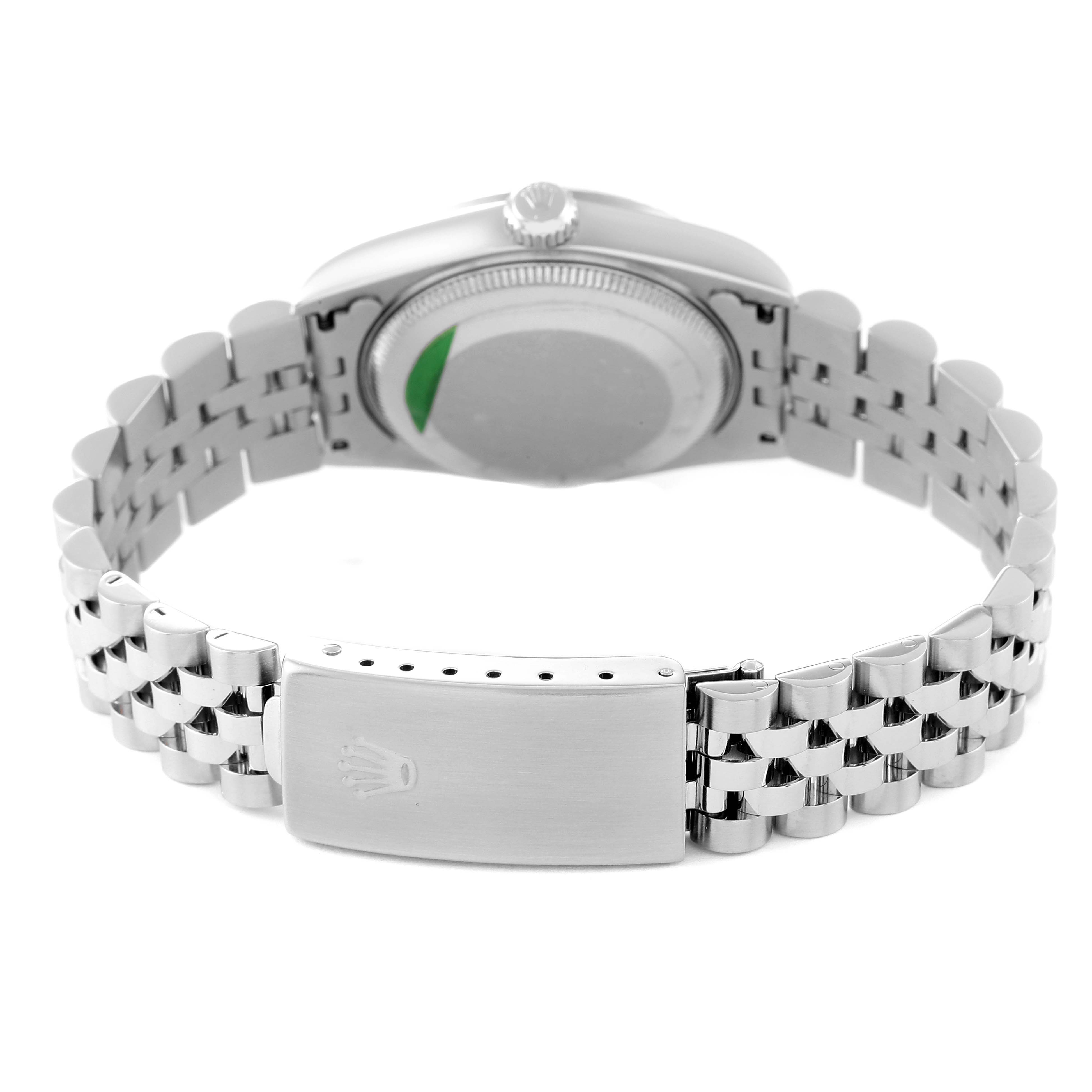 This image shows the back and clasp of a Rolex Datejust 78274 Women's Stainless Steel Black Dial 78274 Women's Stainless Steel Black Dial watch, highlighting its Jubilee bracelet and engraved logo.