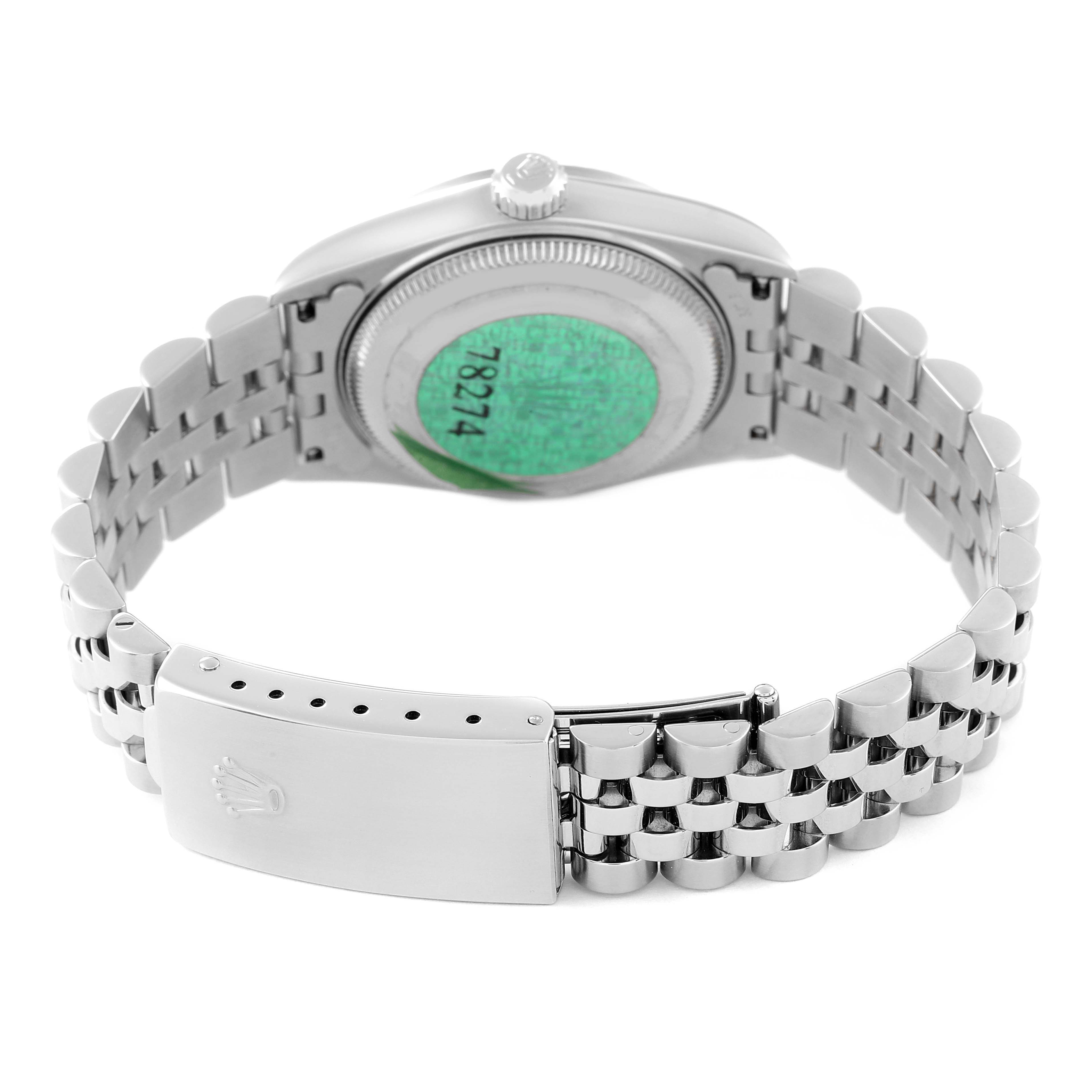 The image shows the back and clasp of a Mid-Size Rolex watch, highlighting the bracelet and case back.