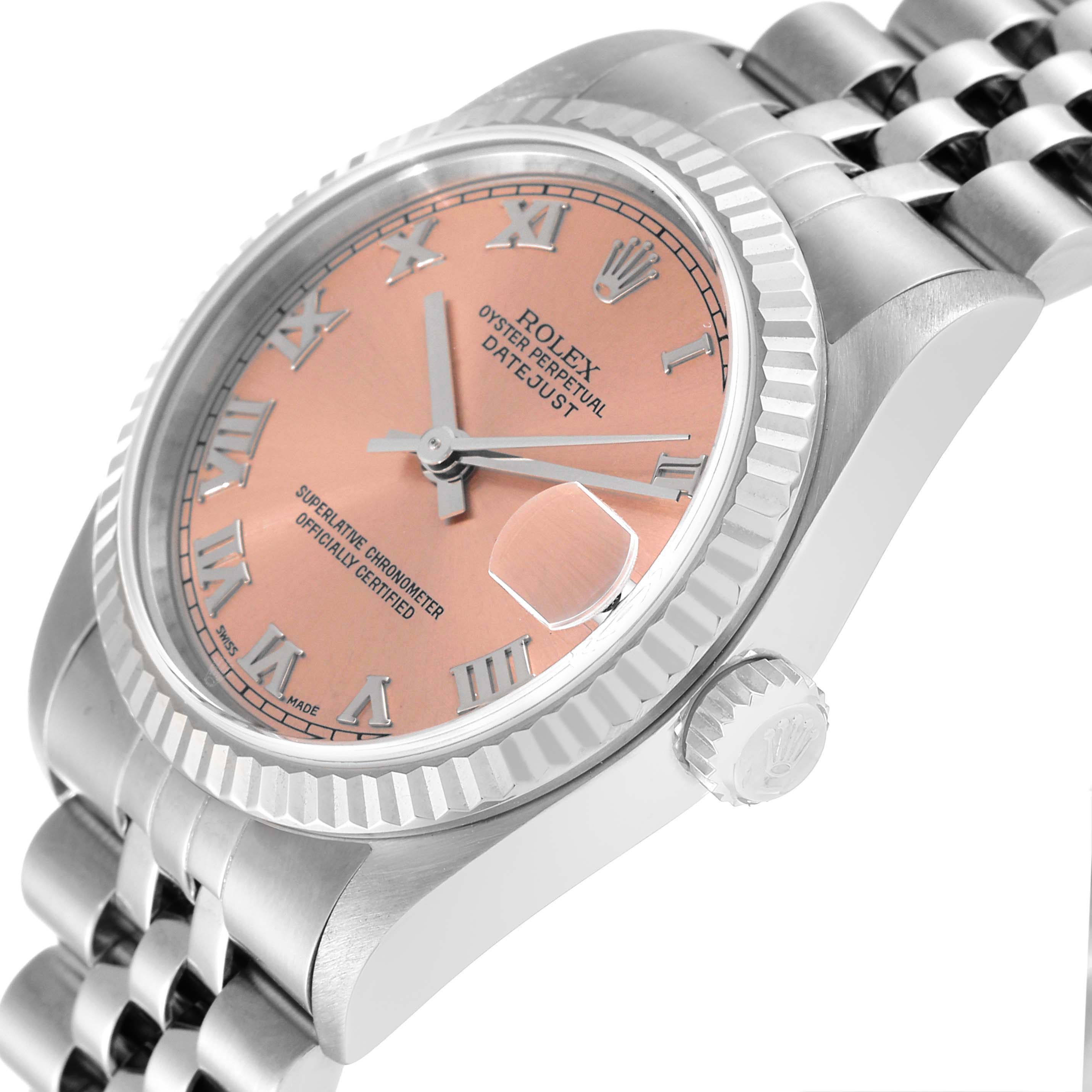The Rolex Mid-Size 78274 Women
s Stainless Steel Pink Dial 78274 Women
s Stainless Steel Pink Dial Datejust is shown at a slight angle, displaying the pink dial, Roman numerals, crown, and part of the bracelet.