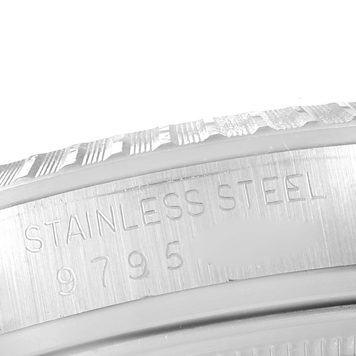 The image shows a close-up of the side engraving on the stainless steel bezel of a Rolex Vintage Collection 16030 Men's Stainless Steel Silver Dial 16030 Men's Stainless Steel Silver Dial model watch.