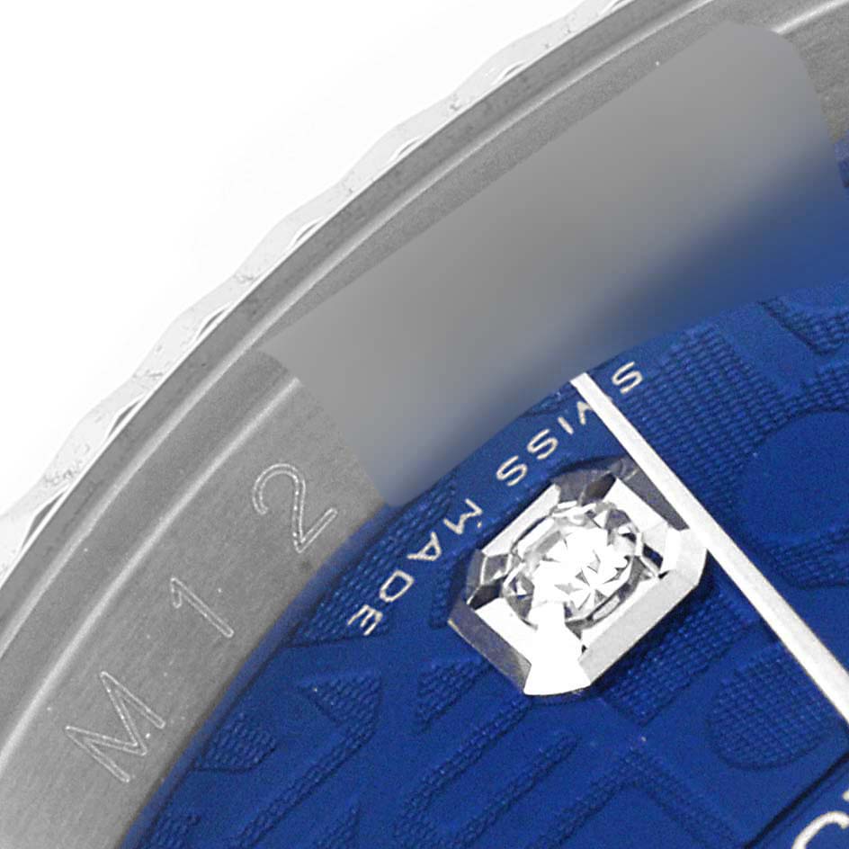 This close-up image shows the partial dial of a Rolex Datejust 116234 Men's Stainless Steel Blue Dial 116234 Men's Stainless Steel Blue Dial watch, highlighting the "Swiss Made" text and a jeweled hour marker.