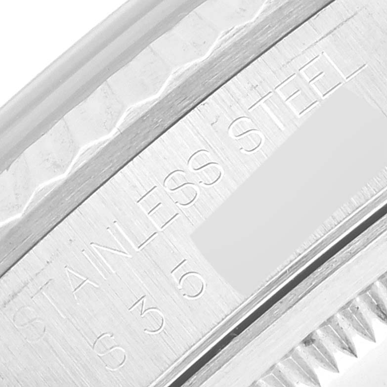 The image shows a close-up of the engraved inner bezel of a Rolex Datejust 16234 Men's Stainless Steel Silver Dial 16234 Men's Stainless Steel Silver Dial watch, highlighting the "STAINLESS STEEL" text and serial numbers.