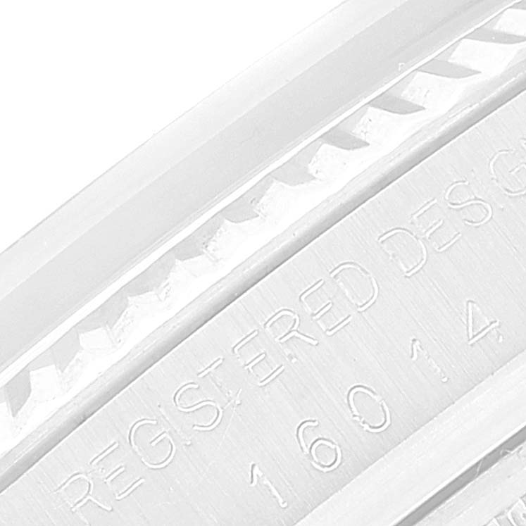 This image shows a close-up of the bezel and case part of the Rolex Vintage Collection 16014 Men
s Stainless Steel Silver Dial 16014 Men
s Stainless Steel Silver Dial model watch, displaying its engraved serial number and text.