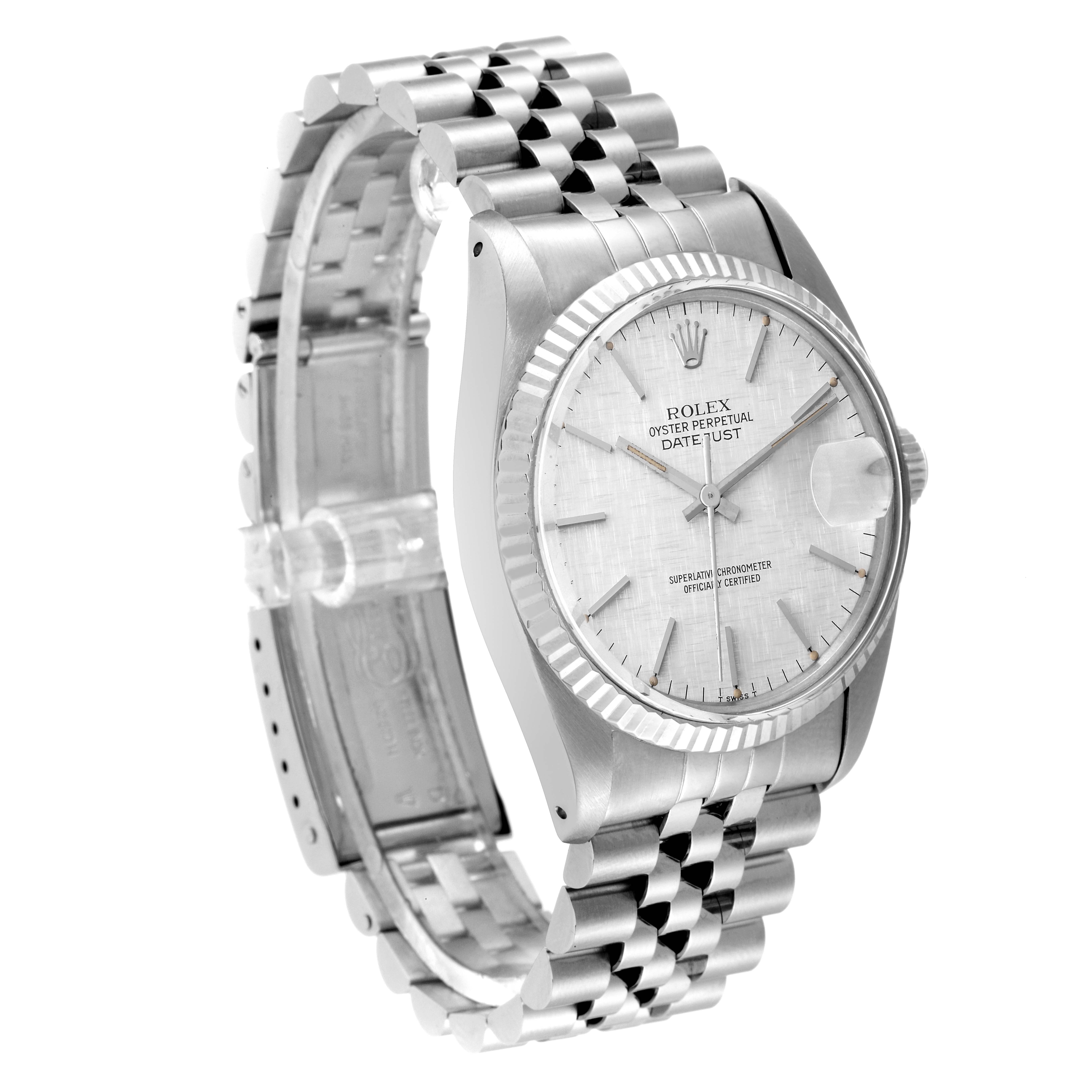The image shows a vintage Rolex Datejust watch from an angle highlighting its face, fluted bezel, and Jubilee bracelet.