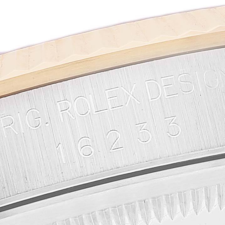The image shows a close-up of the model number engraving on the side of the case of a Rolex Datejust 16233 Men's Steel and Gold (two tone) Black Dial 16233 Men's Steel and Gold (two tone) Black Dial watch.