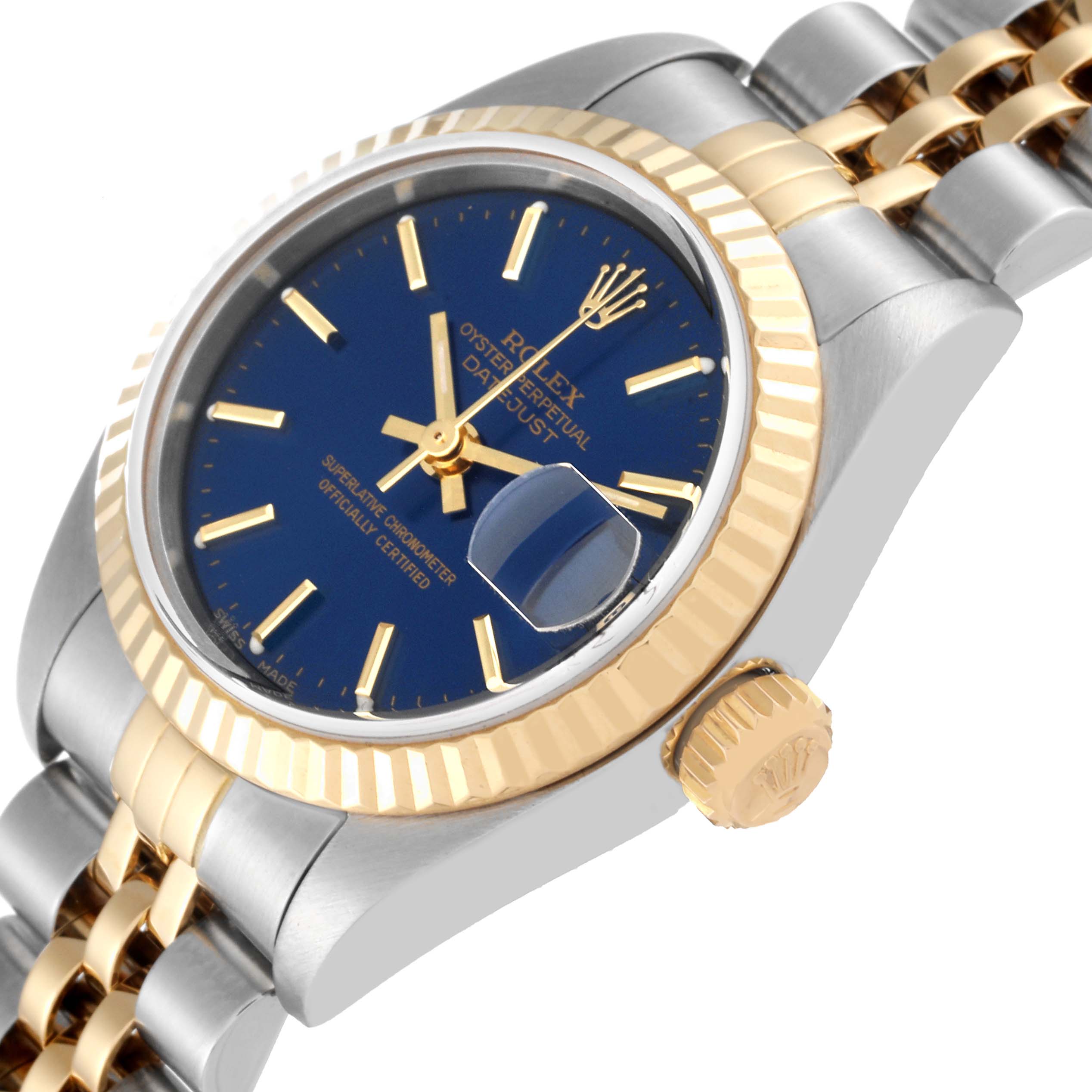 The Rolex Datejust 79173 Women's Steel and Gold (two tone) Blue Dial 79173 Women's Steel and Gold (two tone) Blue Dial watch is shown at an oblique angle, featuring its crown, fluted bezel, and jubilee bracelet.