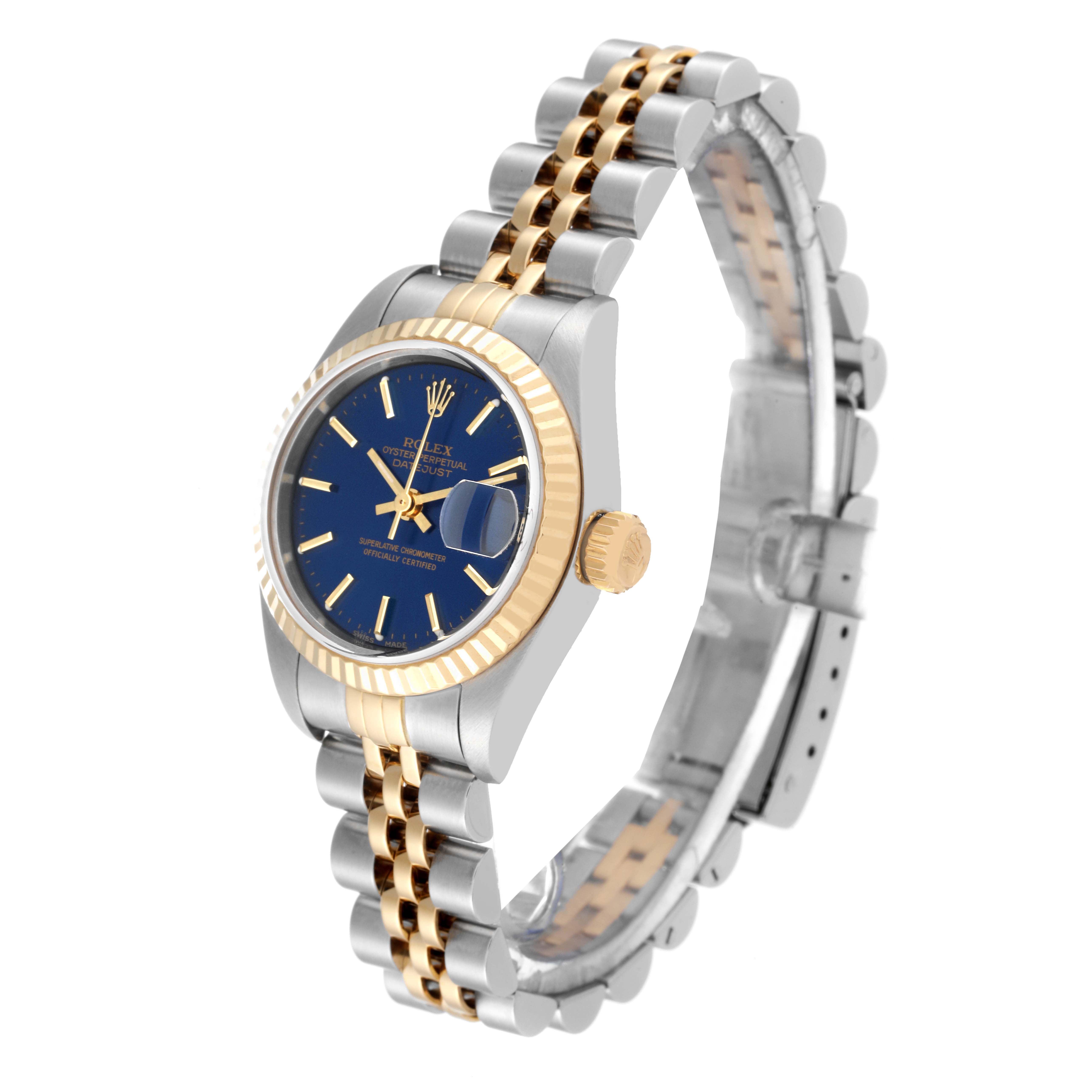 The image shows a Rolex Datejust 79173 Women's Steel and Gold (two tone) Blue Dial 79173 Women's Steel and Gold (two tone) Blue Dial watch at an angled side view, highlighting the blue dial, fluted bezel, and two-tone Jubilee bracelet.