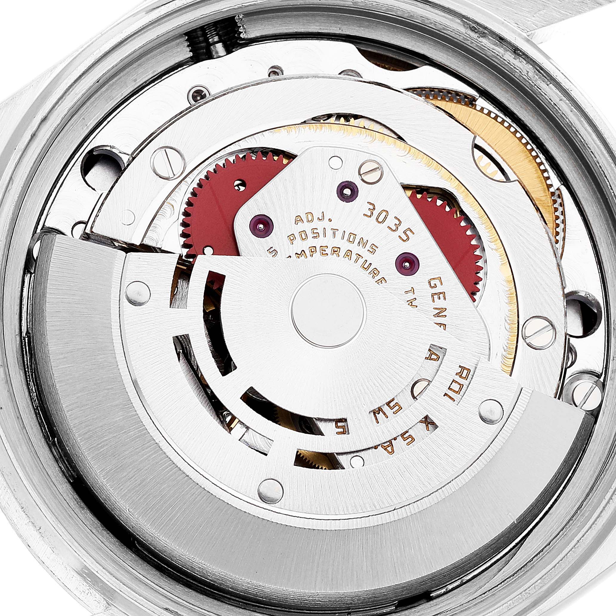 The image shows the movement mechanism of the Rolex Vintage Collection 16013 Men's Steel and Gold (two tone) Champagne Dial 16013 Men's Steel and Gold (two tone) Champagne Dial watch from the back view, displaying gears and engravings.