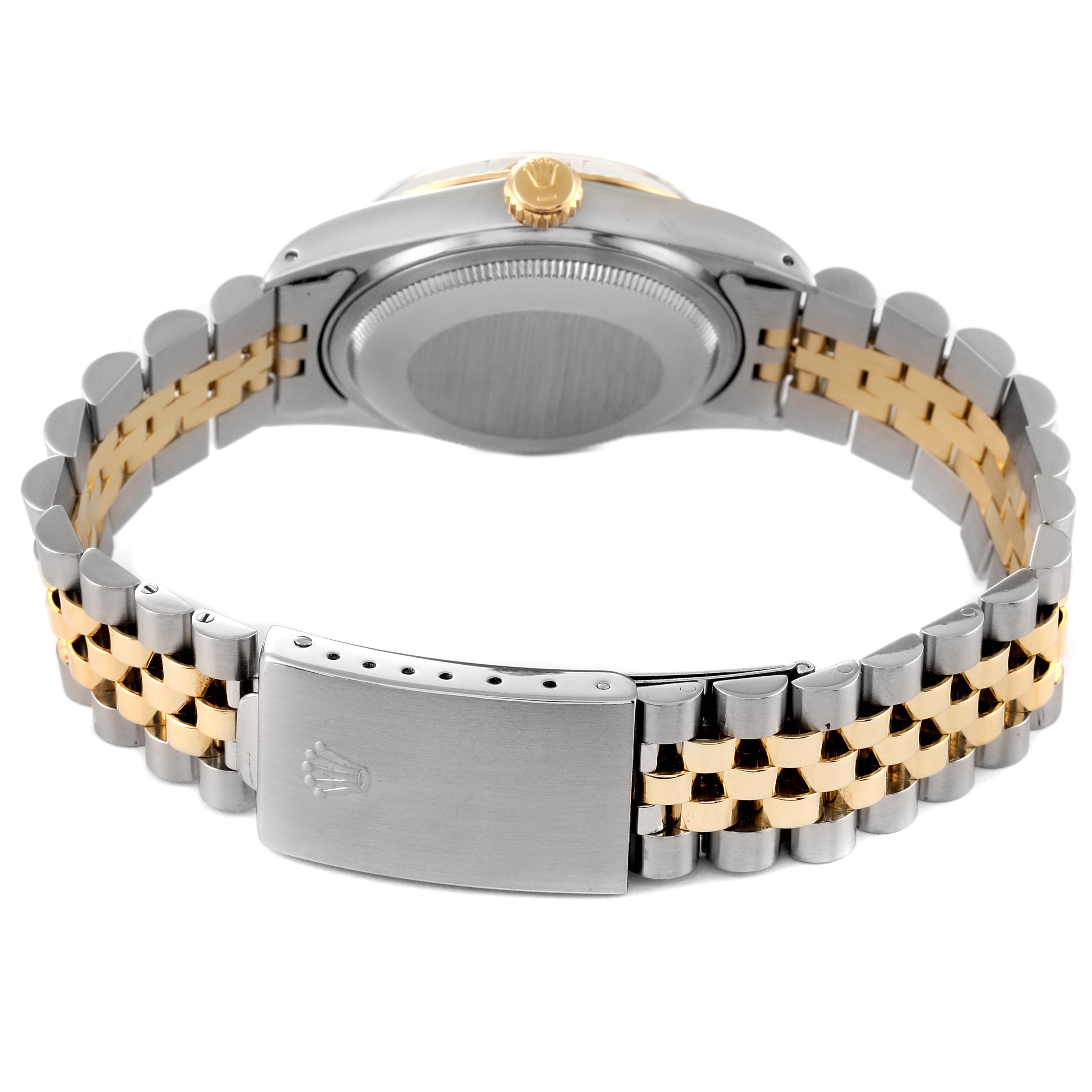 The Rolex Vintage Collection 16013 Men's Steel and Gold (two tone) Champagne Dial 16013 Men's Steel and Gold (two tone) Champagne Dial watch is shown from the back, displaying the case, crown, and Jubilee bracelet clasp.