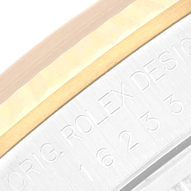 This close-up image shows the engraved bezel and inner rim of a Rolex Datejust 16233 Men's Steel and Gold (two tone) Champagne Dial 16233 Men's Steel and Gold (two tone) Champagne Dial watch.
