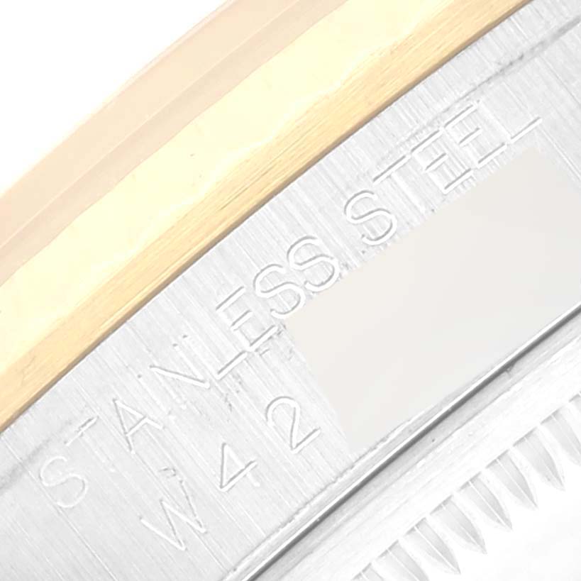 This close-up image shows the outer edge, flange, and partial bezel of the Rolex Datejust 16233 Men's Steel and Gold (two tone) White Dial 16233 Men's Steel and Gold (two tone) White Dial watch with "STAINLESS STEEL" engraving.