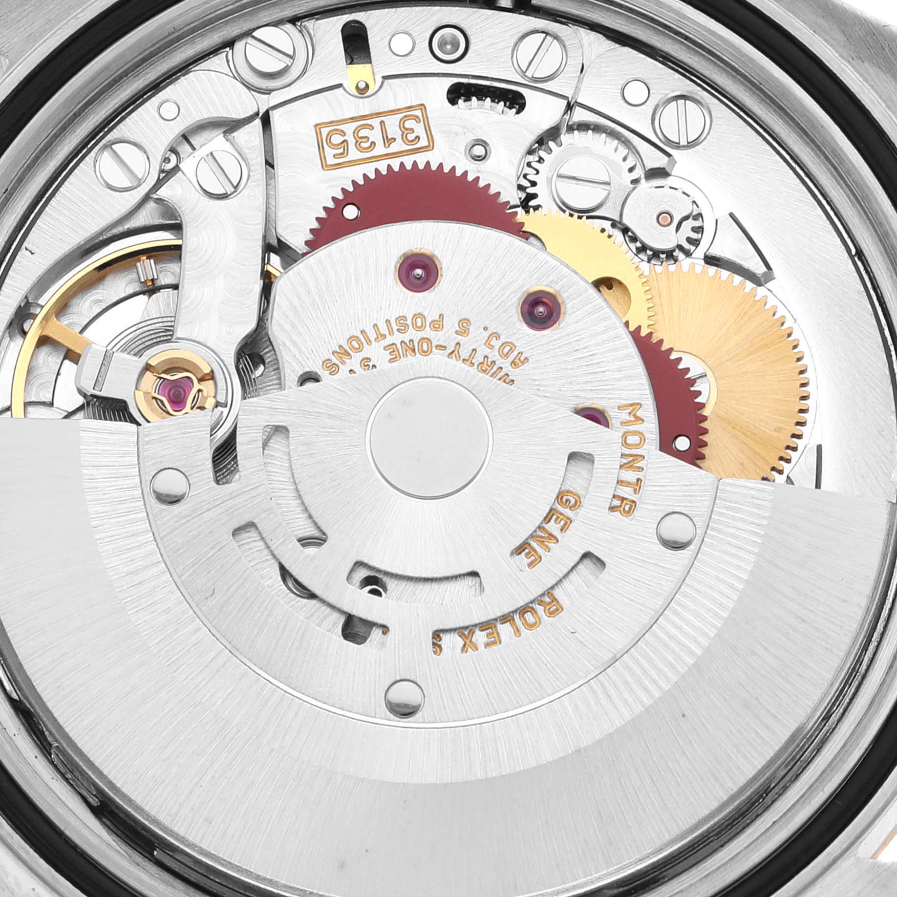 The image shows the intricate movement mechanism of a Rolex Datejust 16233 Men's Steel and Gold (two tone) White Dial 16233 Men's Steel and Gold (two tone) White Dial watch from a close-up, rear angle.