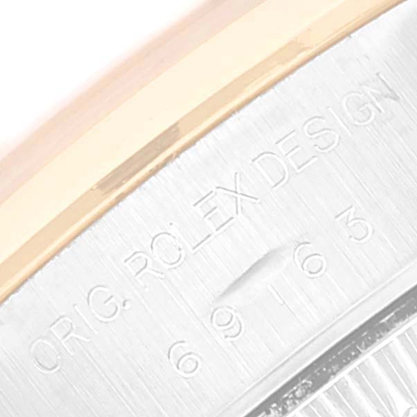 This close-up image shows the engraved side view of the case of a Rolex Datejust 69163 Women's Steel and Gold (two tone) Silver Dial 69163 Women's Steel and Gold (two tone) Silver Dial watch.