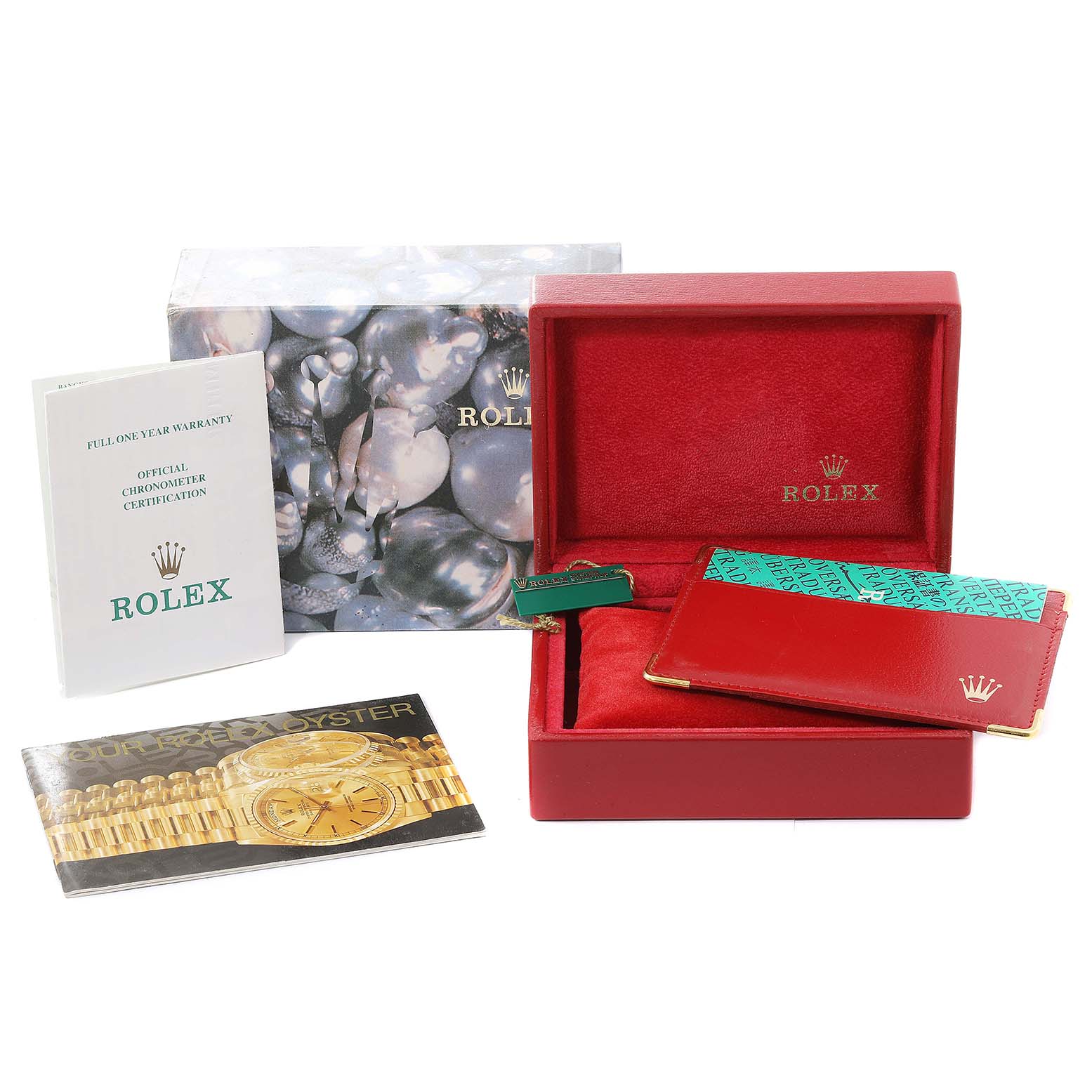 The image shows packaging and accessories for a Rolex Datejust 69163 Women's Steel and Gold (two tone) Silver Dial 69163 Women's Steel and Gold (two tone) Silver Dial model, including the box, booklet, and warranty card.