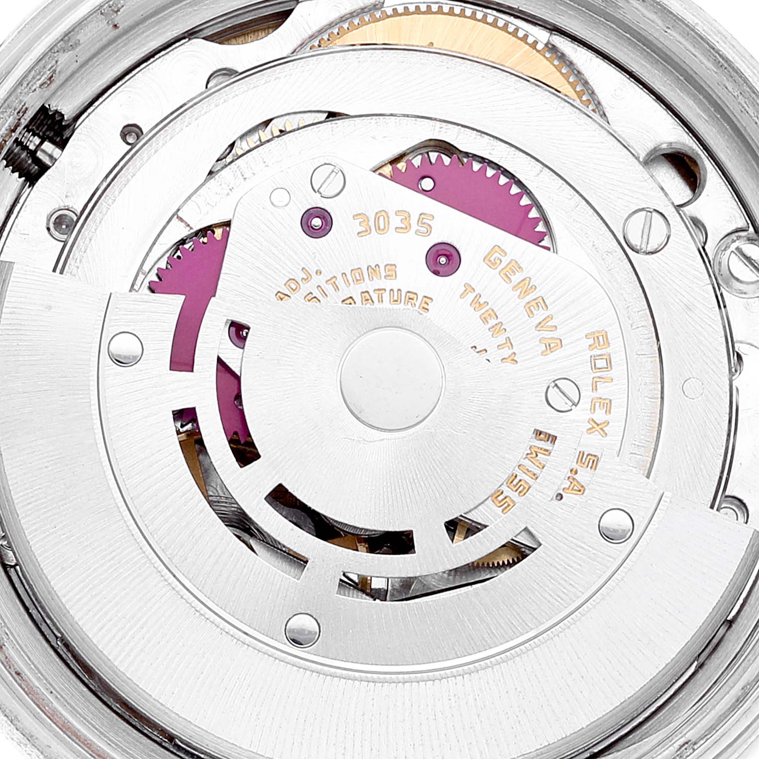 The image shows the internal mechanism of a Vintage Collection Rolex model, highlighting gears and the engraved details of the movement.