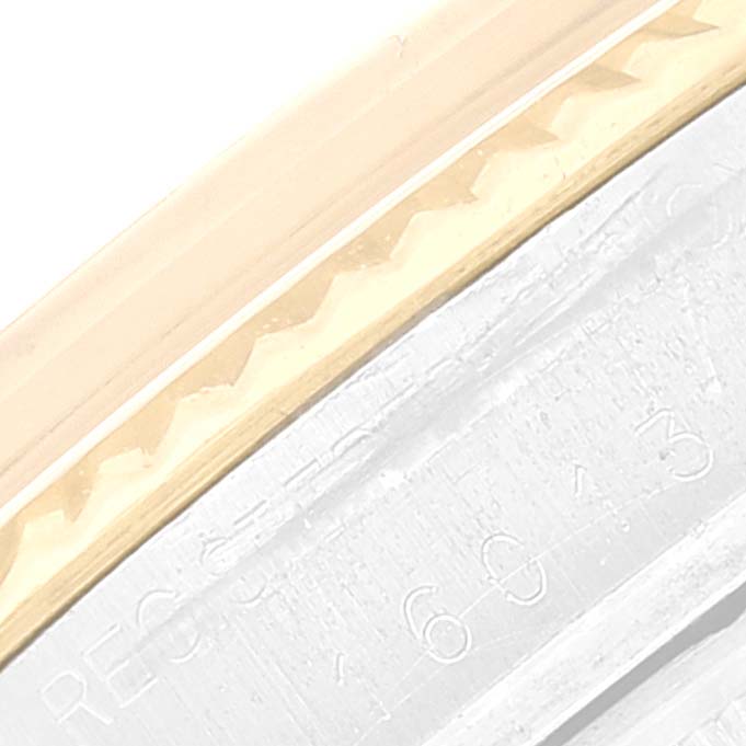 This image shows a close-up of the bezel and part of the case for the Vintage Collection model by Rolex.