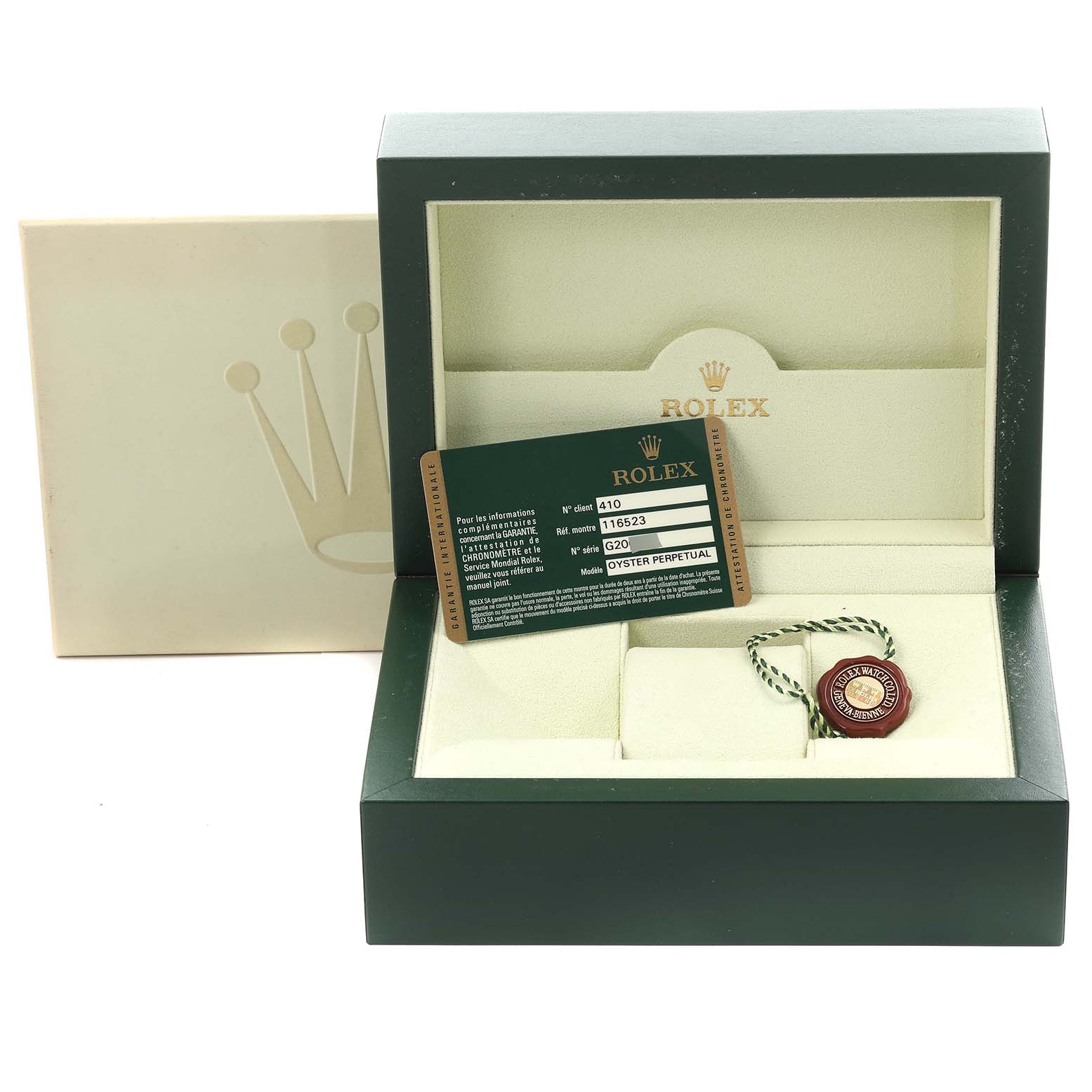 The image shows a Rolex Daytona 116523 Men's Steel and Gold (two tone) Silver Dial 116523 Men's Steel and Gold (two tone) Silver Dial watch box with its warranty card and a tag inside.