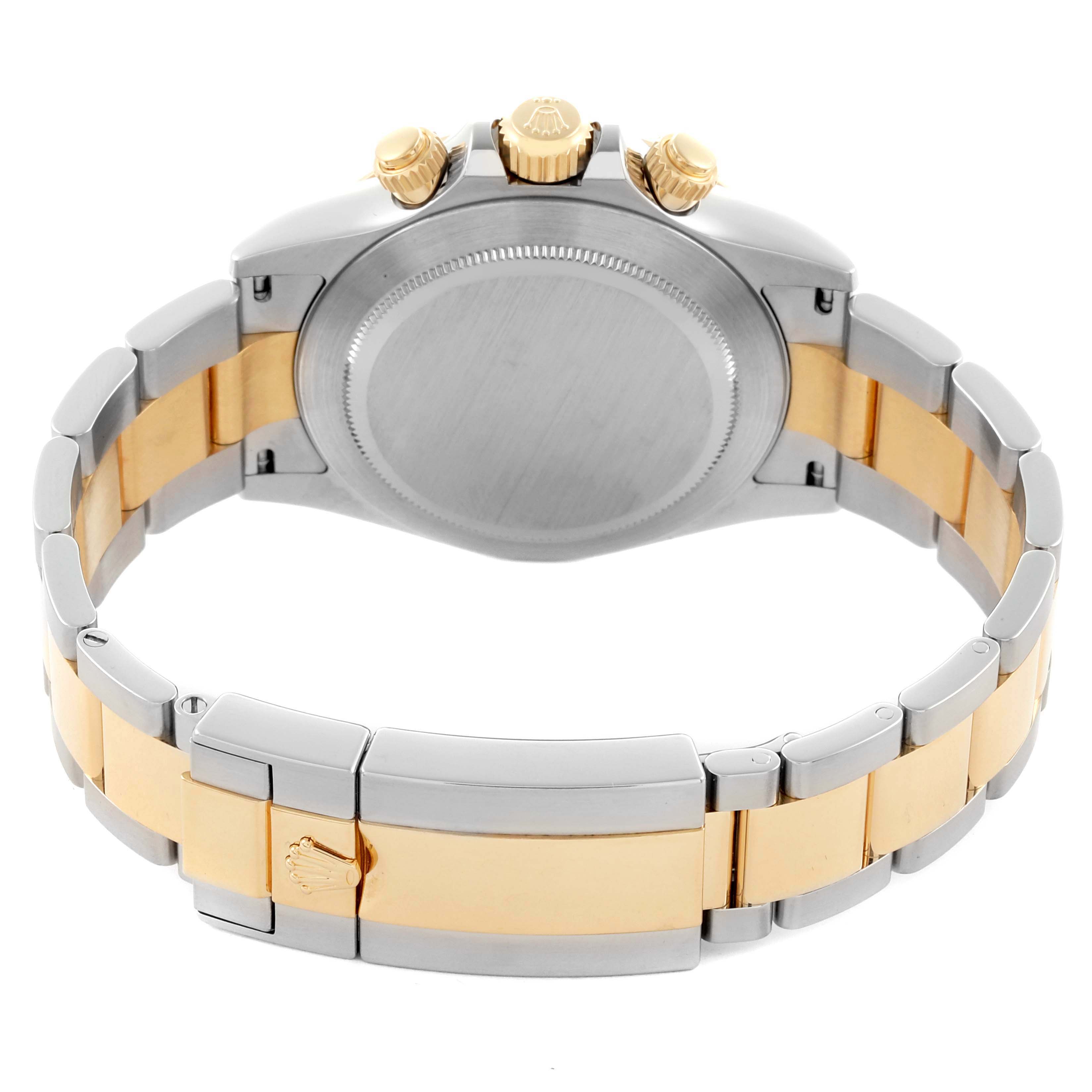 The Rolex Daytona 116523 Men's Steel and Gold (two tone) Silver Dial 116523 Men's Steel and Gold (two tone) Silver Dial watch is shown from a rear angle, highlighting the case back and two-tone bracelet.