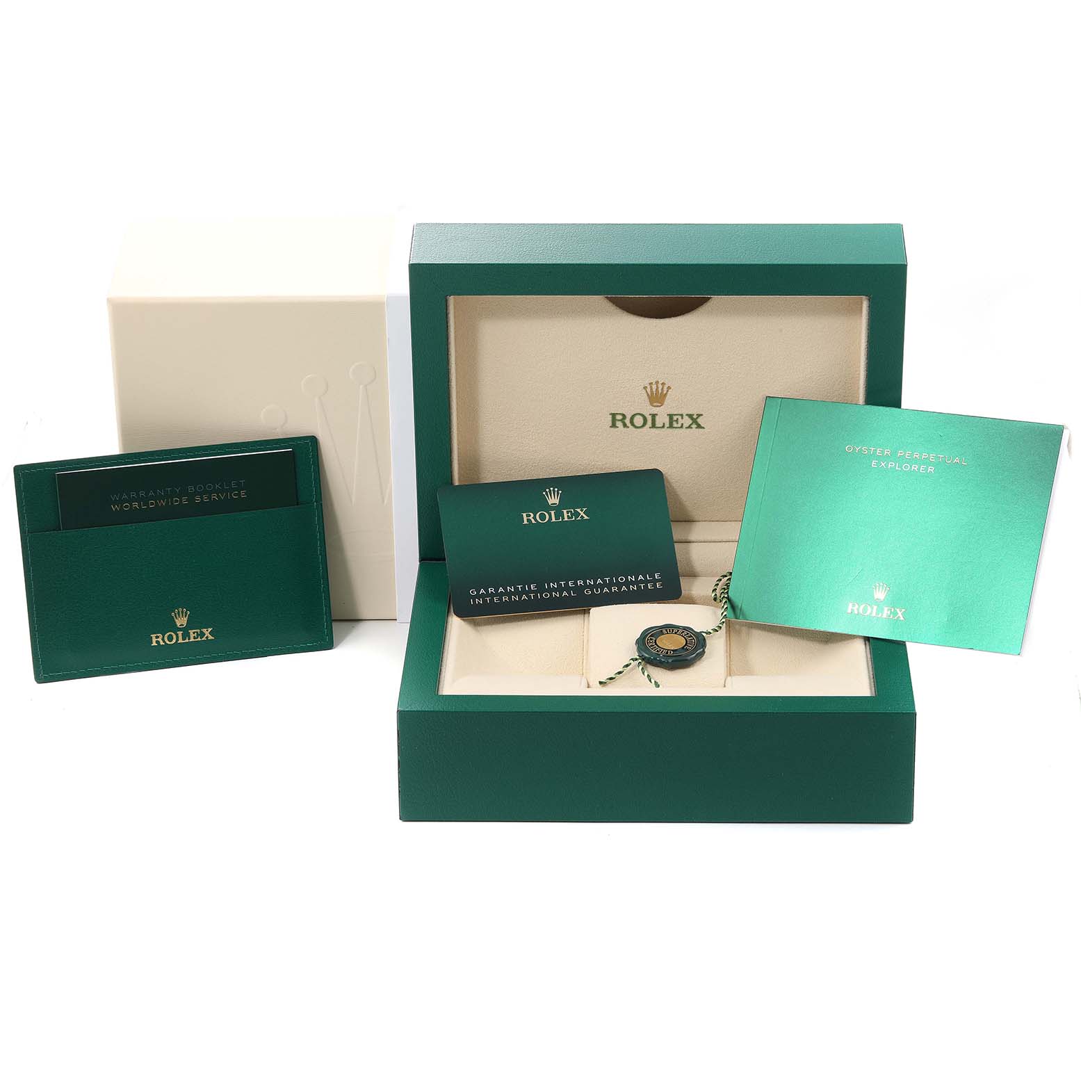 The image shows the packaging, booklet, warranty card, and other accessories for the Rolex Explorer 124270 Men
s Stainless Steel Black Dial 124270 Men
s Stainless Steel Black Dial watch model.