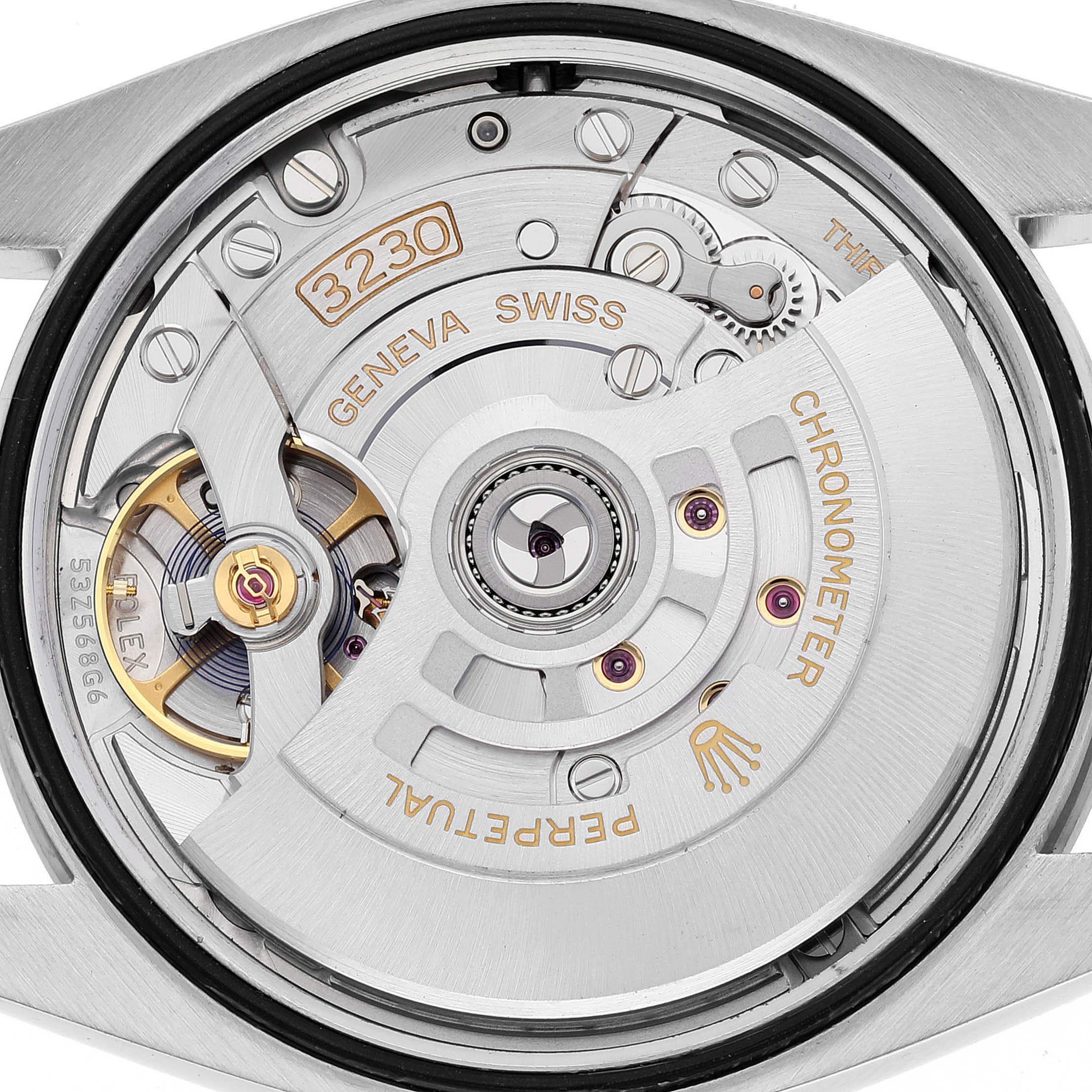 Close-up of the movement and inner mechanisms of a Rolex Explorer 124270 Men
s Stainless Steel Black Dial 124270 Men
s Stainless Steel Black Dial watch, displaying intricate parts and inscriptions.