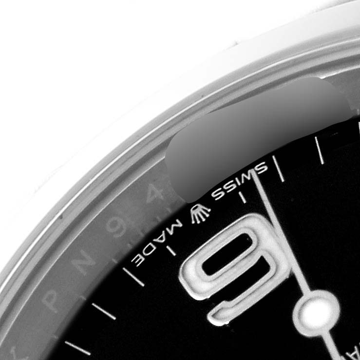 The image shows a close-up, angled view of the dial on the Rolex Explorer 124270 Men
s Stainless Steel Black Dial 124270 Men
s Stainless Steel Black Dial model, focusing on the "9" numeral and "Swiss Made" text.