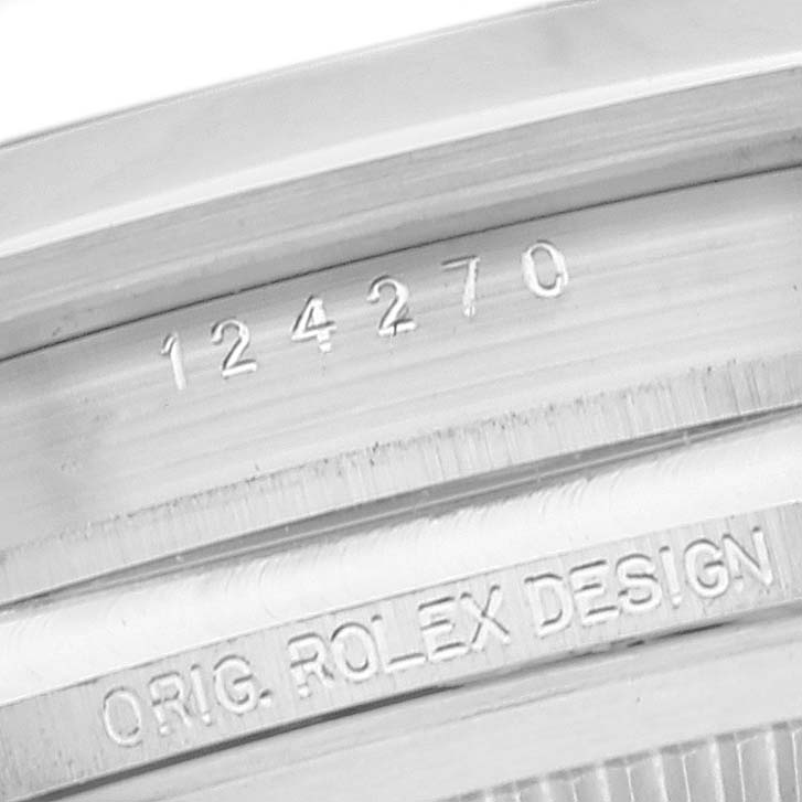 This image shows a close-up view of the engraving on the inner bezel of a Rolex Explorer 124270 Men
s Stainless Steel Black Dial 124270 Men
s Stainless Steel Black Dial model watch.