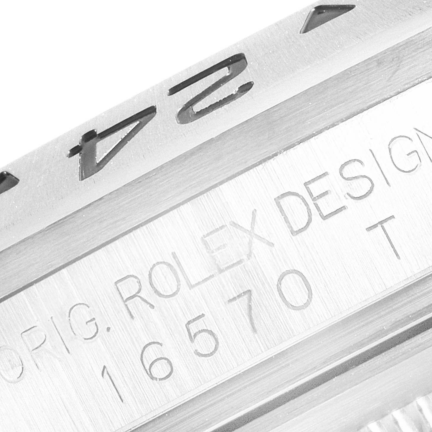 The image shows a close-up of the engraved bezel and design number on a Rolex Explorer 16570 Men's Stainless Steel White Dial 16570 Men's Stainless Steel White Dial model watch.