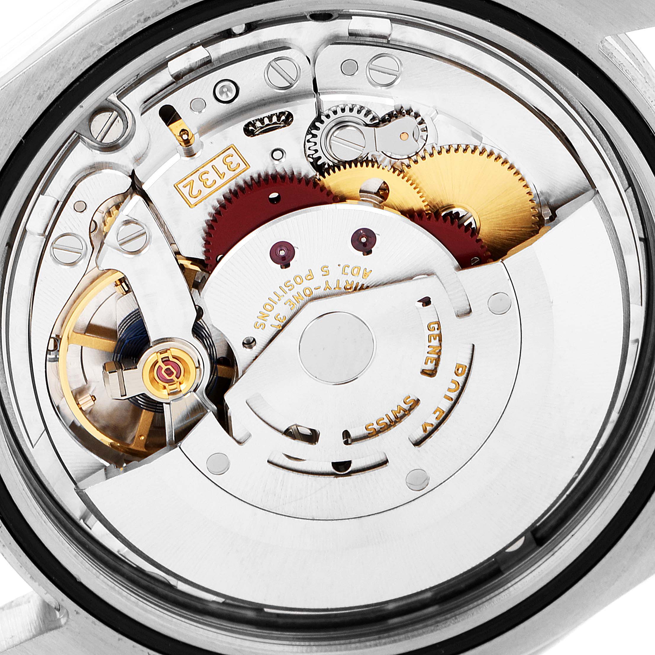 This image shows the intricate movement and internal mechanism of a Rolex Oyster Perpetual 114300 Men
s Stainless Steel Black Dial 114300 Men
s Stainless Steel Black Dial watch from a close-up, rear angle.