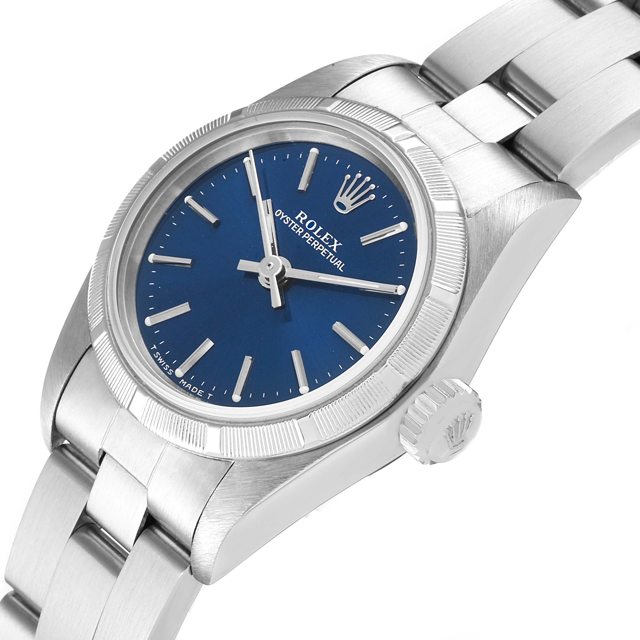 This image shows a Rolex Oyster Perpetual 67230 Women's Stainless Steel Blue Dial 67230 Women's Stainless Steel Blue Dial watch at a slight angle, highlighting the blue dial, crown, and part of the bracelet.
