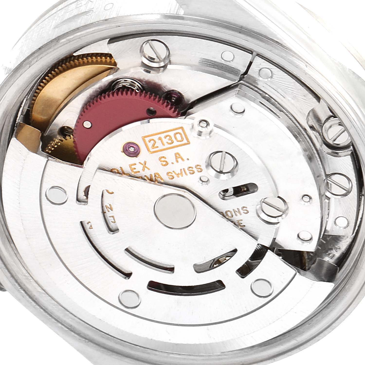 This image shows a close-up of the movement mechanism of the Rolex Oyster Perpetual 67230 Women's Stainless Steel Blue Dial 67230 Women's Stainless Steel Blue Dial model, highlighting its intricate internal components.