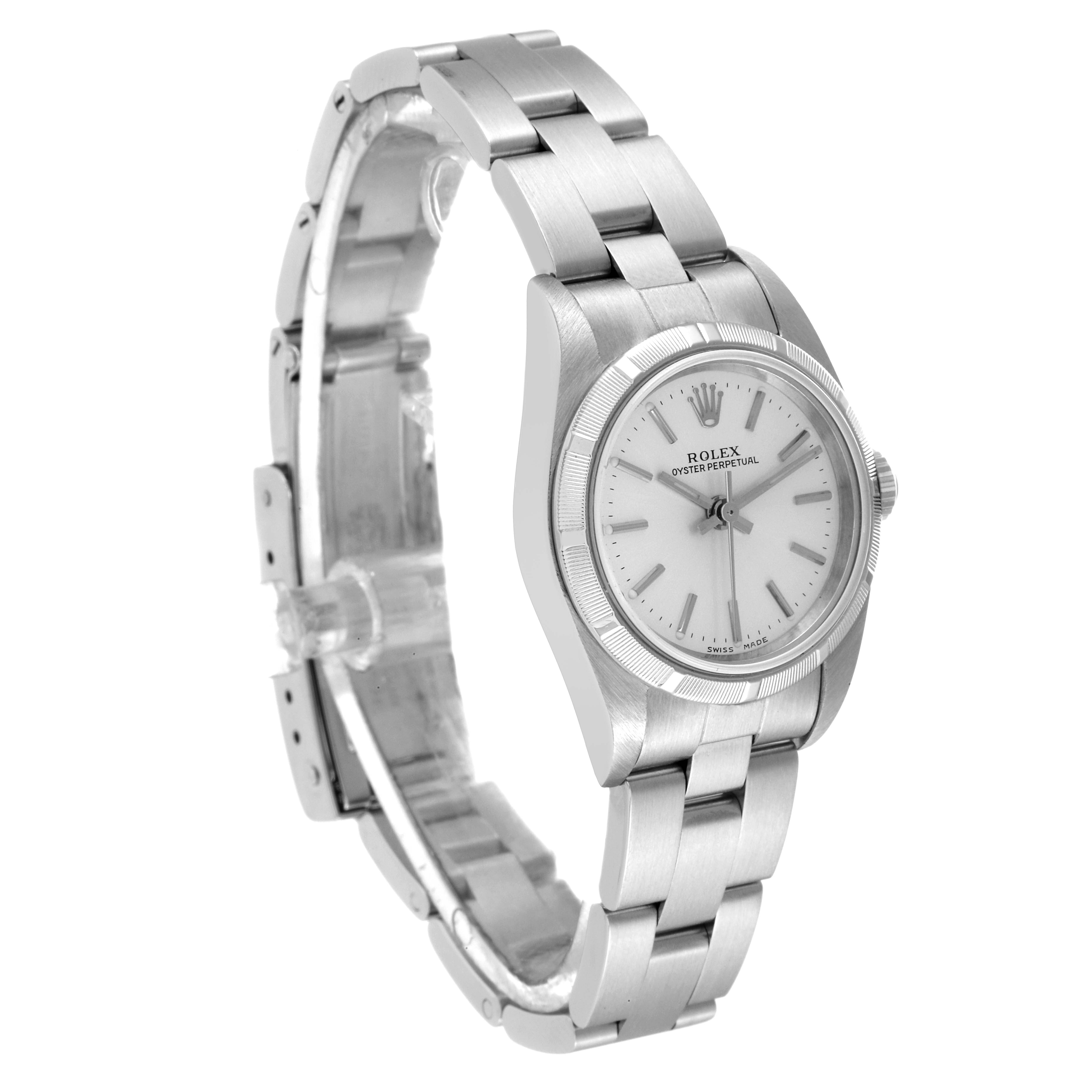 The image shows a side angle of the Rolex Oyster Perpetual 76030 Women
s Stainless Steel Silver Dial 76030 Women
s Stainless Steel Silver Dial watch, displaying the face, bezel, and bracelet.