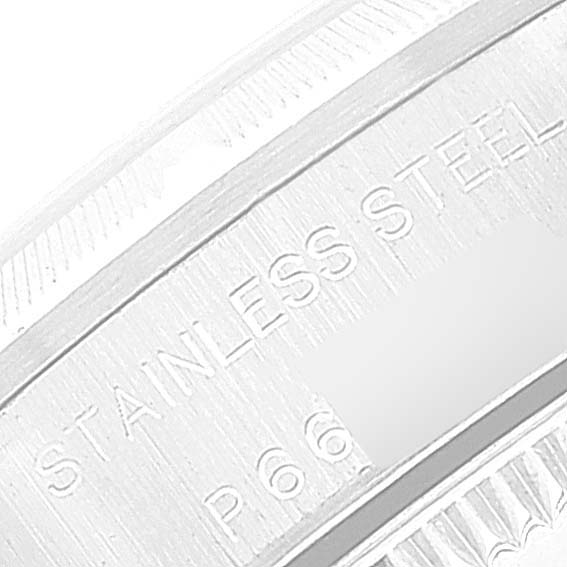 This image shows a close-up of the side of the bezel of a Rolex Oyster Perpetual 76030 Women
s Stainless Steel Silver Dial 76030 Women
s Stainless Steel Silver Dial watch inscribed with "STAINLESS STEEL."