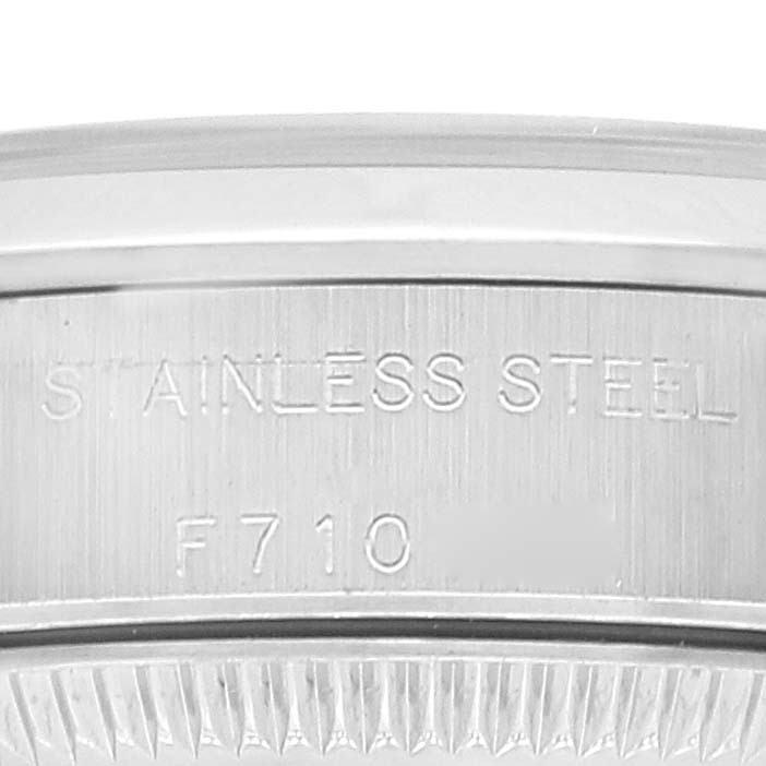 The image shows an engraved section of the stainless steel caseback of a Rolex Oyster Perpetual 76080 Women
s Stainless Steel Silver Dial 76080 Women
s Stainless Steel Silver Dial watch, with the model number visible.