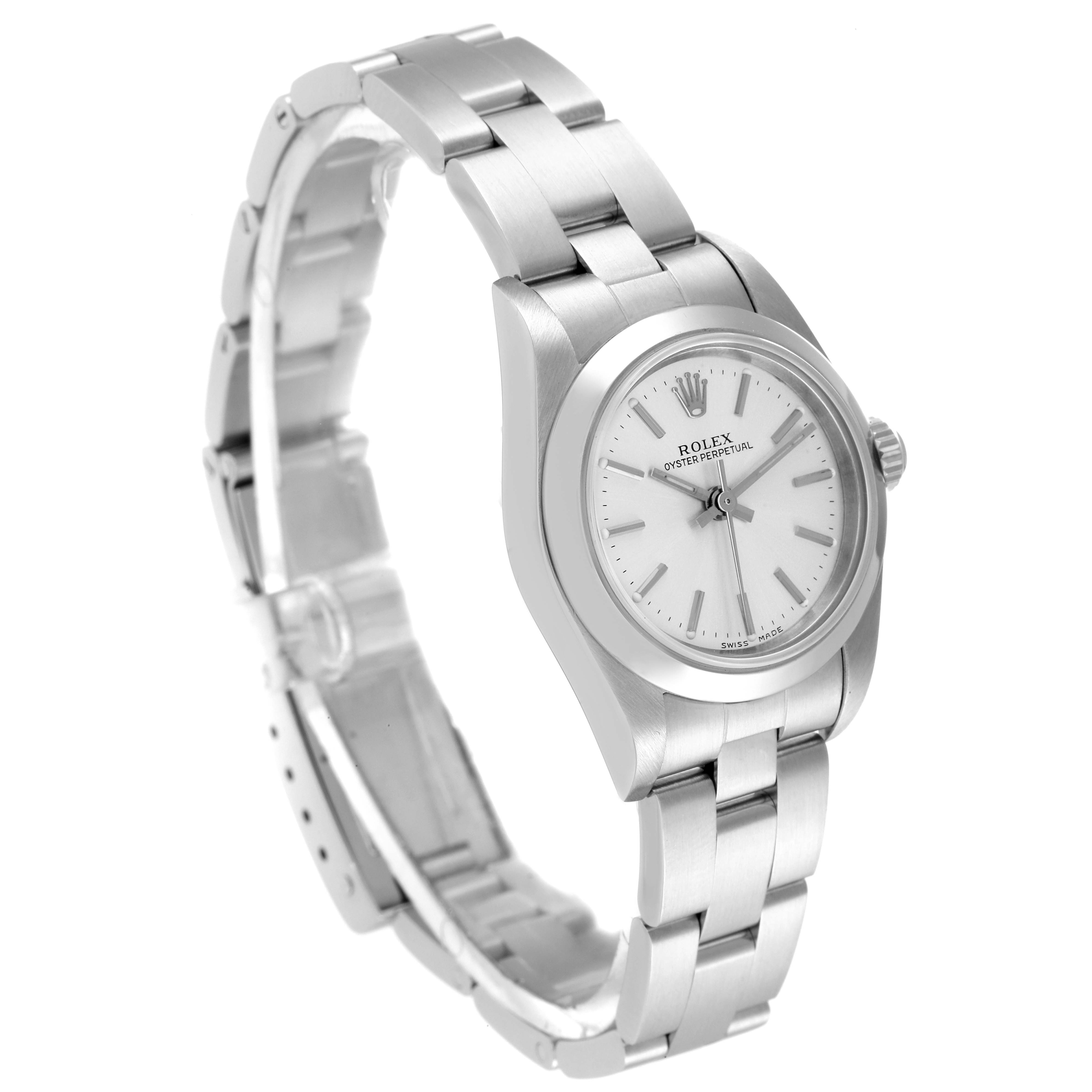 The image shows a Rolex Oyster Perpetual 76080 Women
s Stainless Steel Silver Dial 76080 Women
s Stainless Steel Silver Dial watch from a slight side angle, featuring its silver bracelet and white dial.