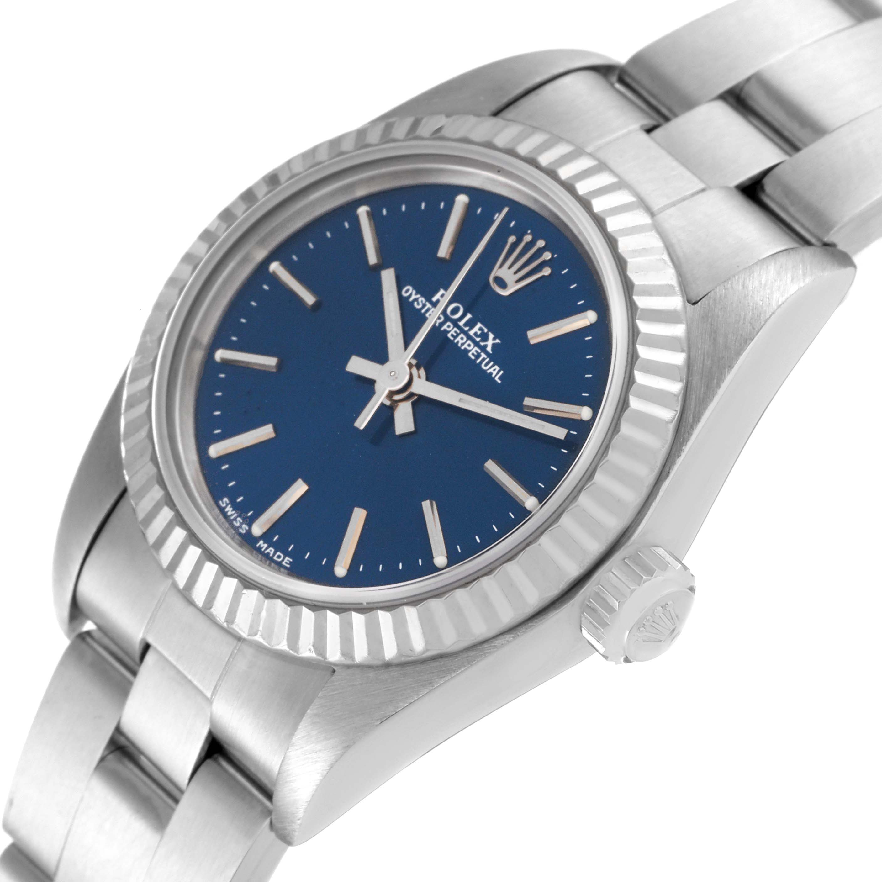 The image shows a close-up angle of a Rolex Oyster Perpetual 76094 Women
s Stainless Steel Blue Dial 76094 Women
s Stainless Steel Blue Dial watch, highlighting the face, crown, and part of the bracelet.