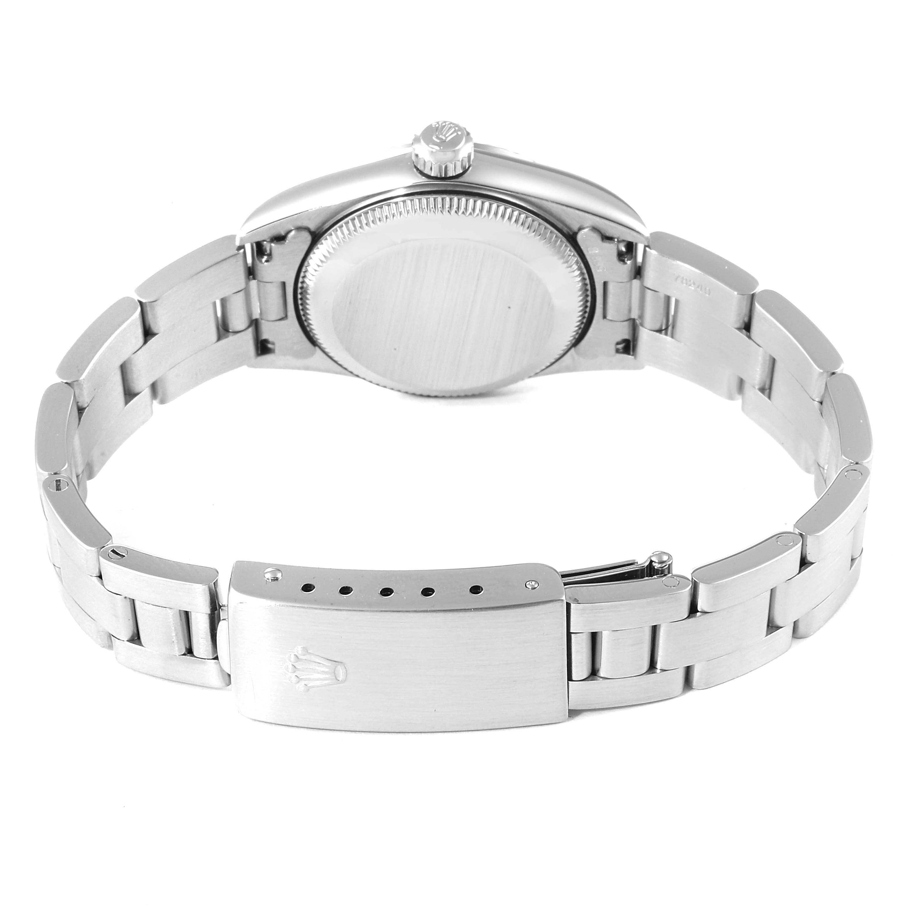 This image shows the back view of a Rolex Oyster Perpetual 76094 Women's Stainless Steel Silver Dial 76094 Women's Stainless Steel Silver Dial watch, including its case back, crown, and bracelet with clasp.