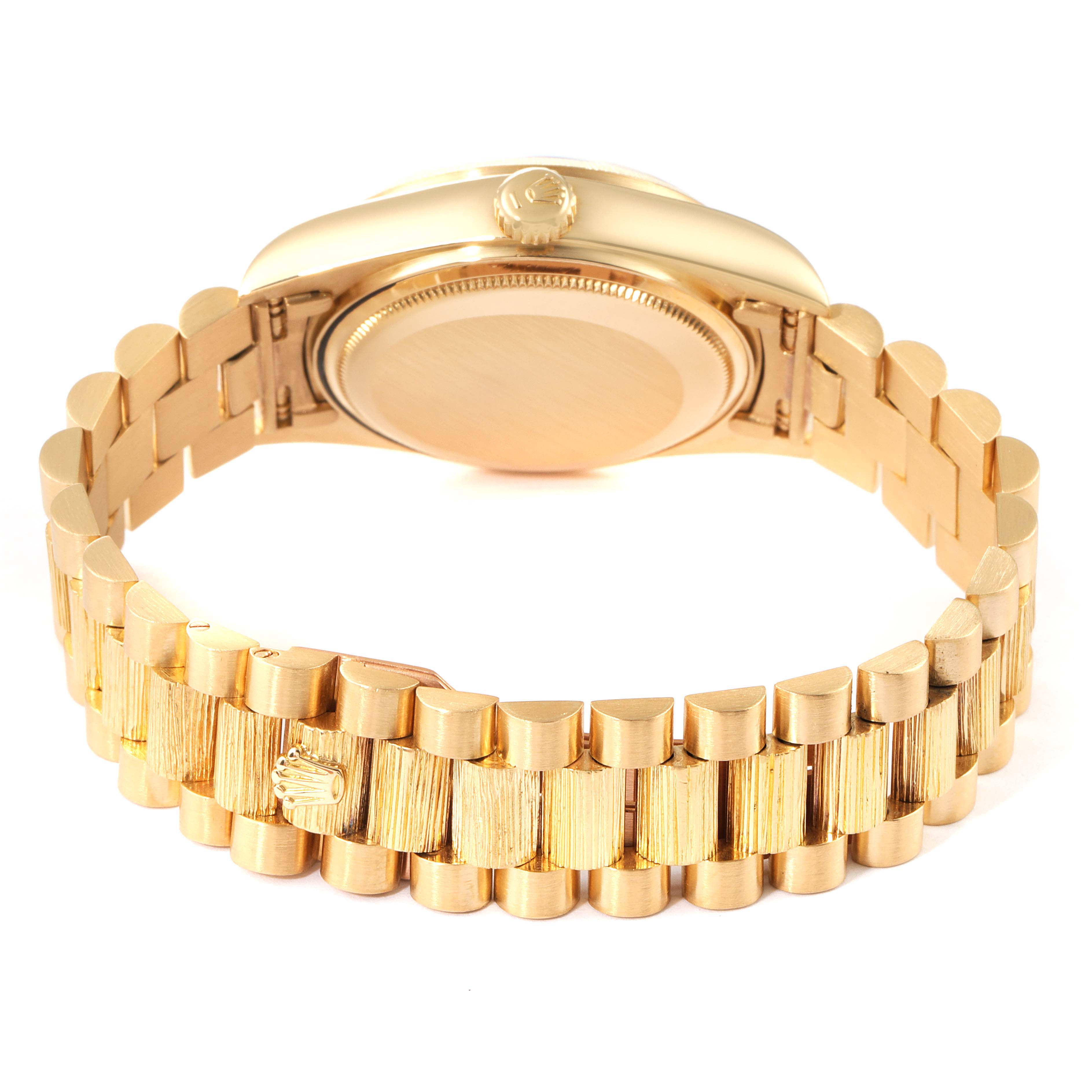 This image shows the back and bracelet of a Rolex President 18078 Men
s Yellow Gold Champagne Dial 18078 Men
s Yellow Gold Champagne Dial model watch, focusing on the gold links and back case.