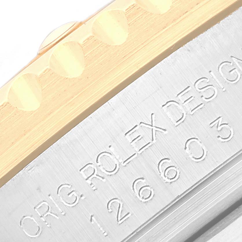 Close-up view of the engraved model number and bezel of the Rolex Sea-Dweller 126603 Men
s Steel and Gold (two tone) Black Dial 126603 Men
s Steel and Gold (two tone) Black Dial watch.