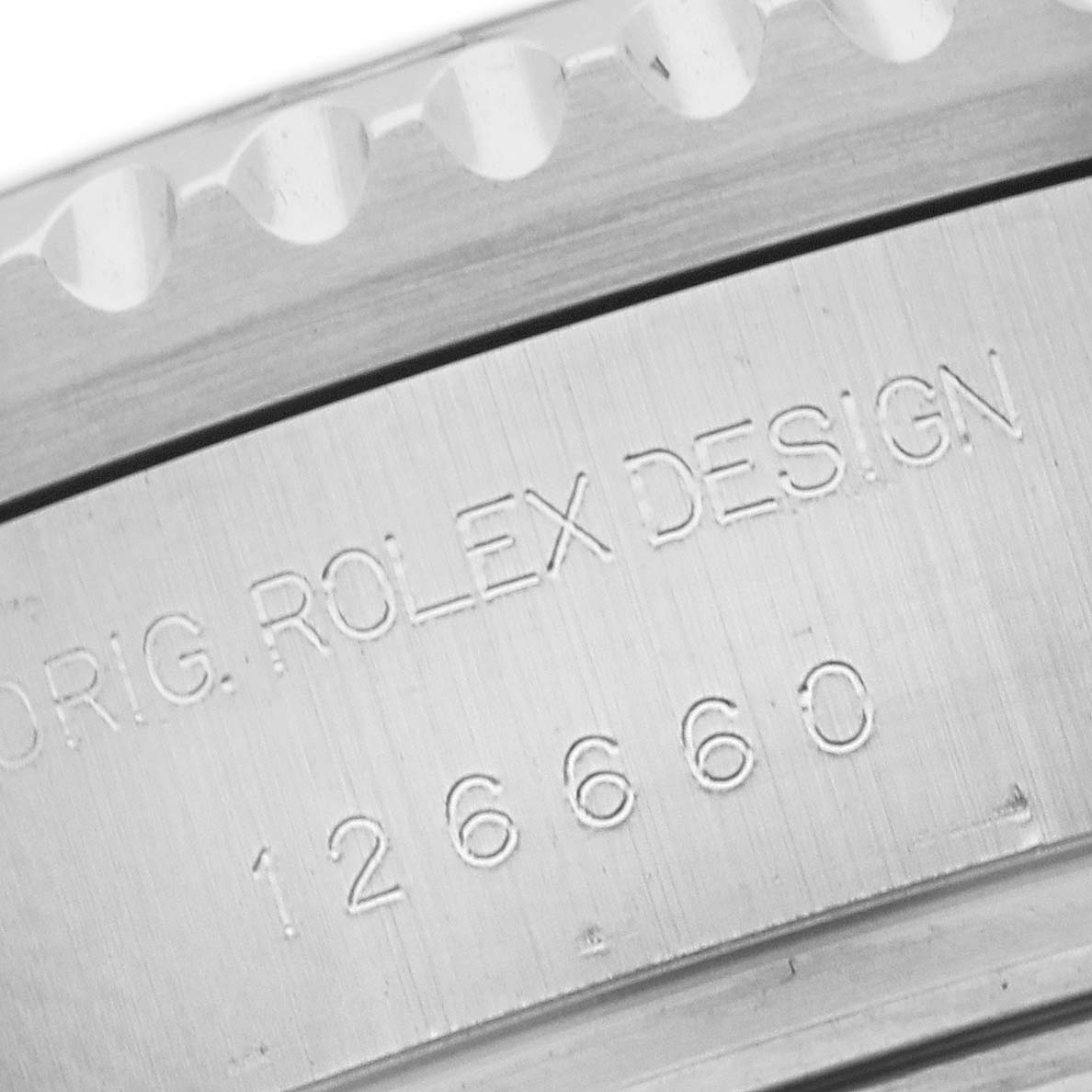 The image shows the engraved inner bezel of a Rolex Sea-Dweller 126660 Men's Stainless Steel Black Dial with the model number 126660.