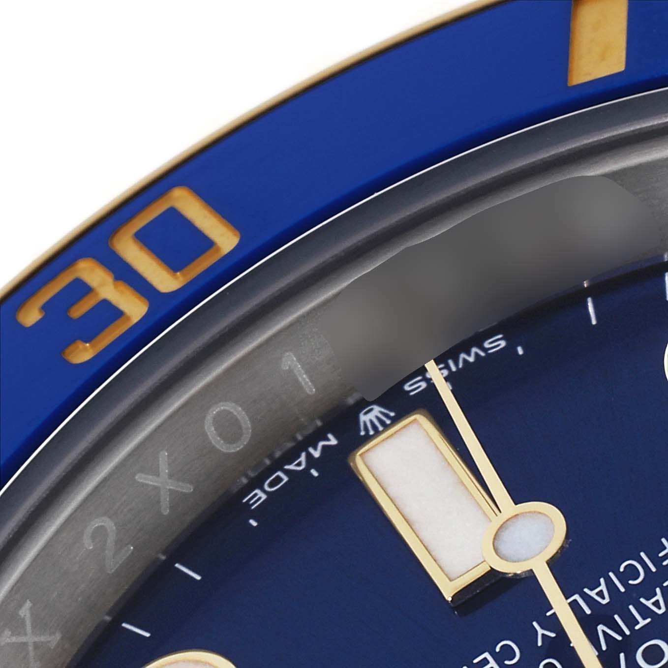 The image shows a close-up of the blue dial and bezel of a Rolex Submariner 126613 Men's Steel and Gold (two tone) Blue Dial 126613 Men's Steel and Gold (two tone) Blue Dial, highlighting the minute markers and numeral "30" on the bezel.
