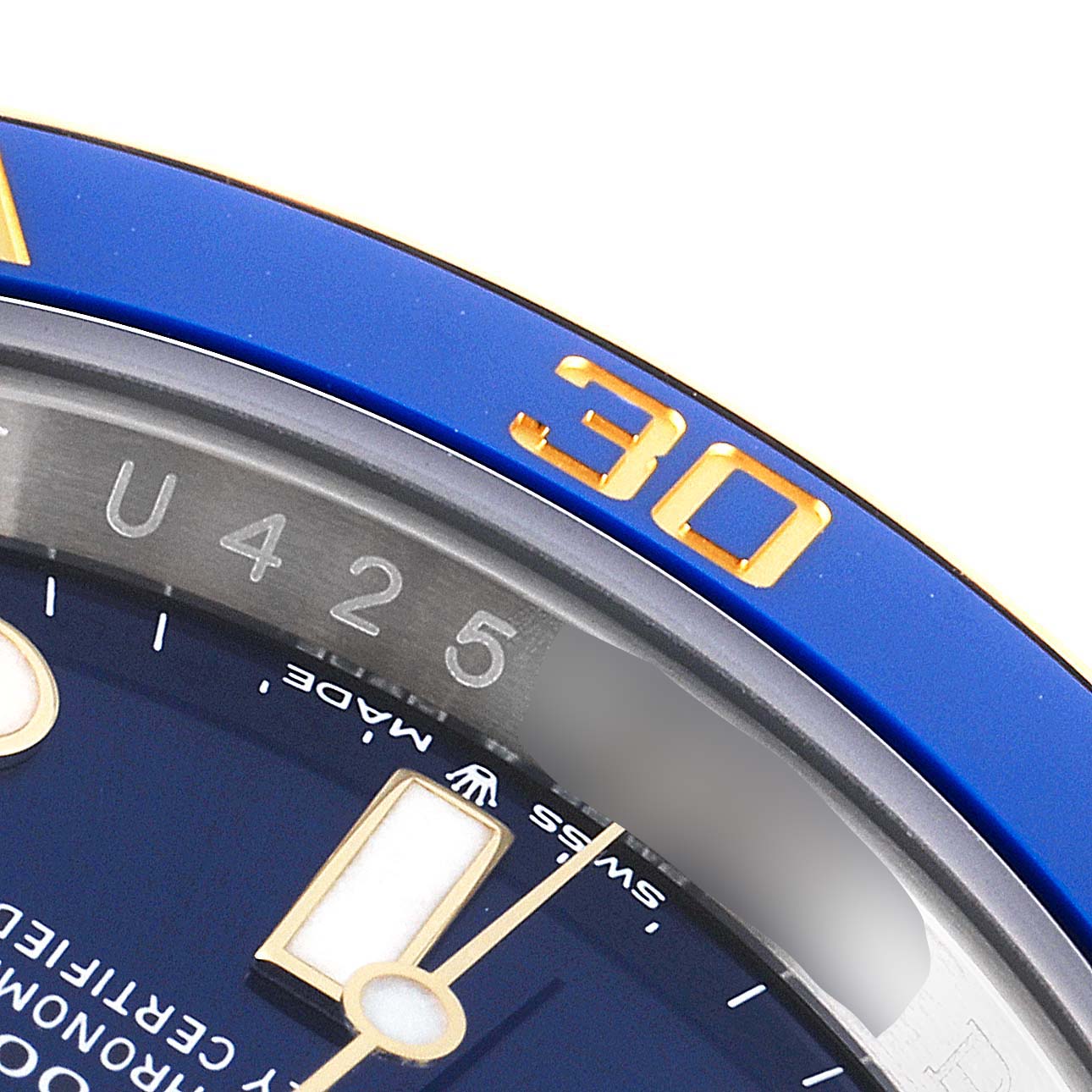 This close-up shows the bezel and dial of the Rolex Submariner 126613LB Men's Steel and Gold (two tone) Blue Dial 126613LB Men's Steel and Gold (two tone) Blue Dial watch, focusing on the minute markers and "30" numeral.