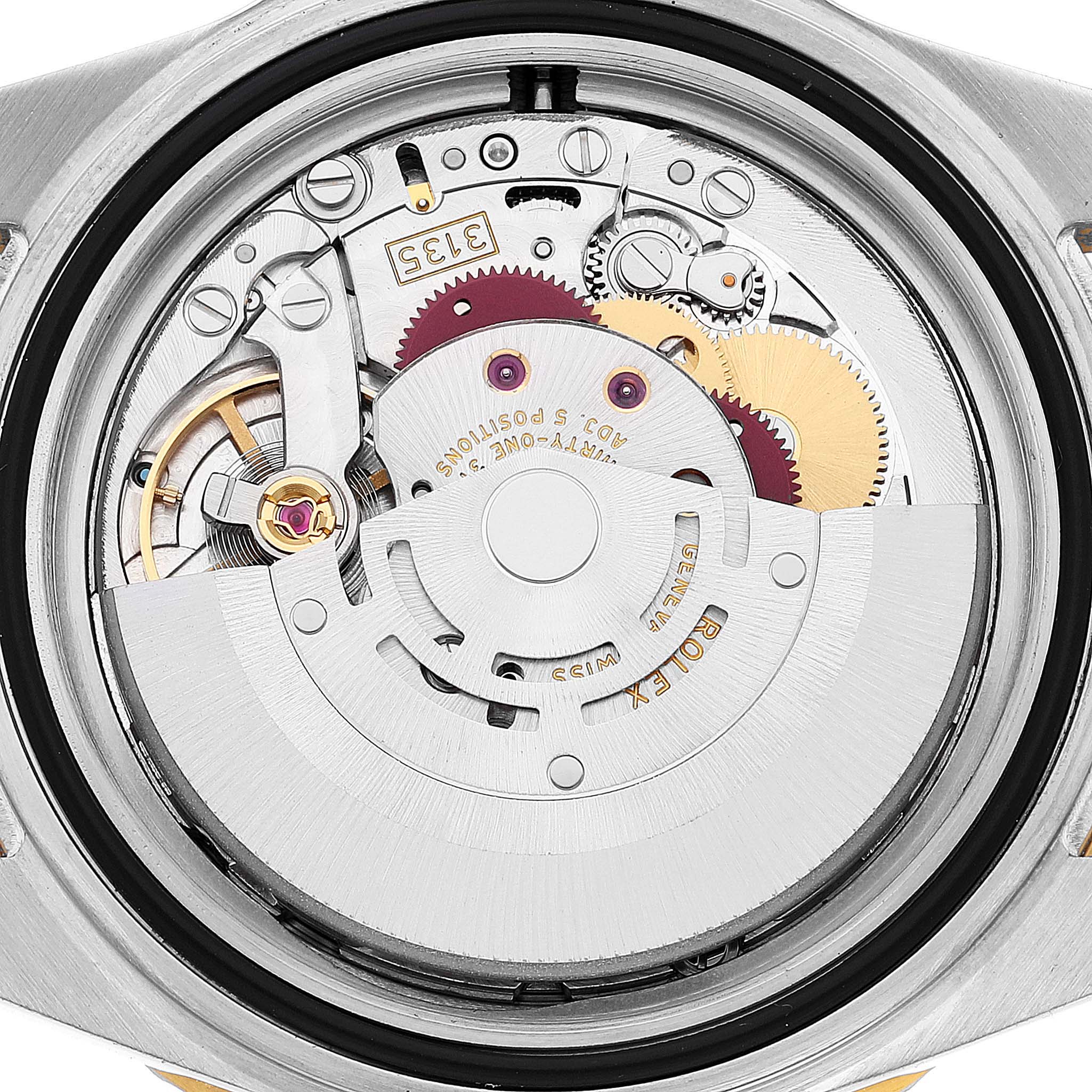 This image shows a close-up view of the movement of a Rolex Submariner 16613 Men's Steel and Gold (two tone) Blue Dial 16613 Men's Steel and Gold (two tone) Blue Dial watch from the back.