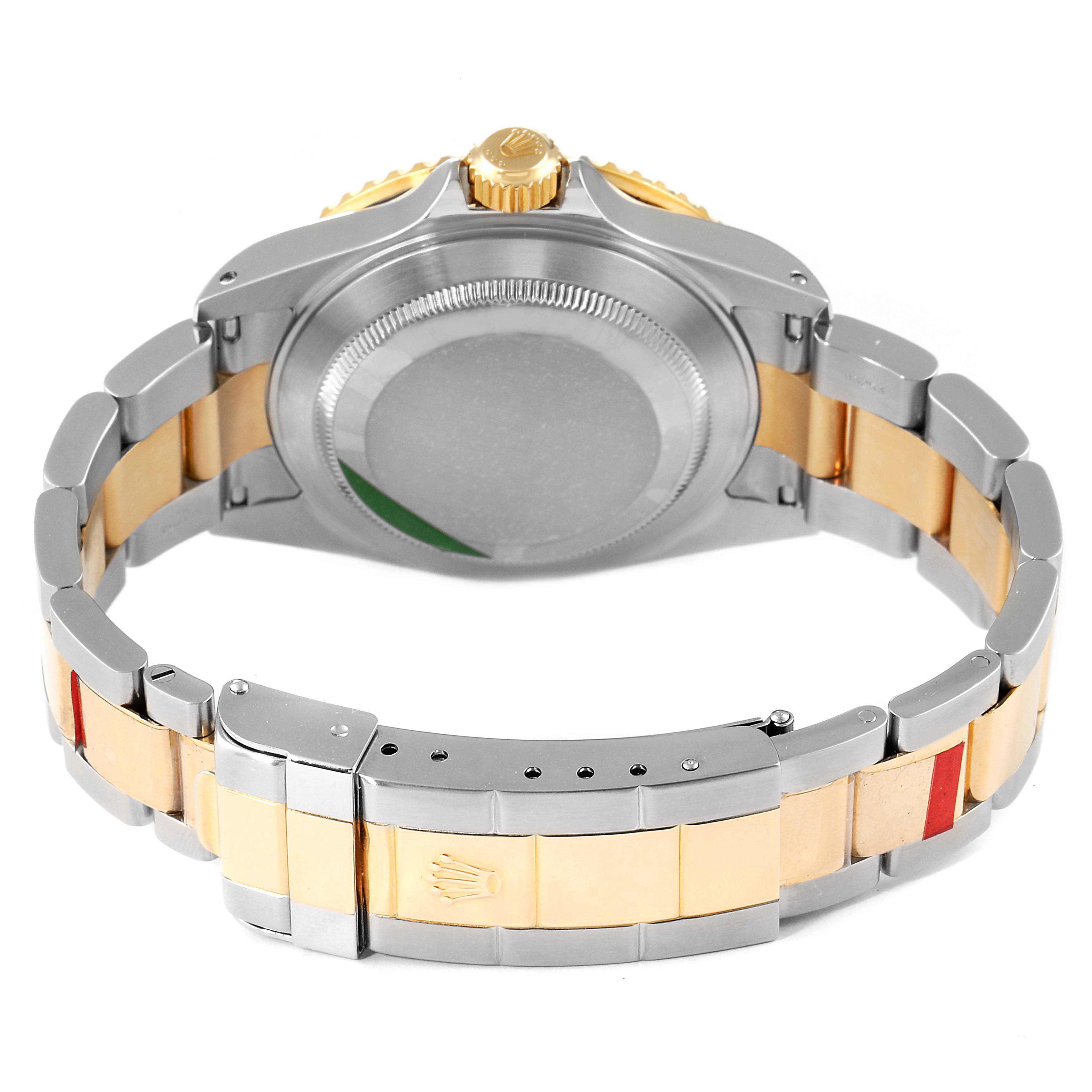 The image shows the back and bracelet of the Rolex Submariner 16613 Men's Steel and Gold (two tone) Black Dial 16613 Men's Steel and Gold (two tone) Black Dial watch from a rear angle.