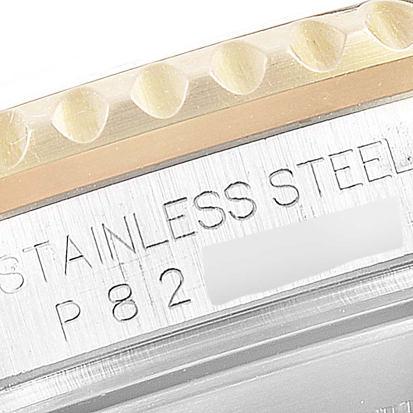 The image shows a close-up of the engraved case side of a Rolex Submariner 16613 Men's Steel and Gold (two tone) Black Dial 16613 Men's Steel and Gold (two tone) Black Dial, highlighting the text "STAINLESS STEEL" and part of the bezel.