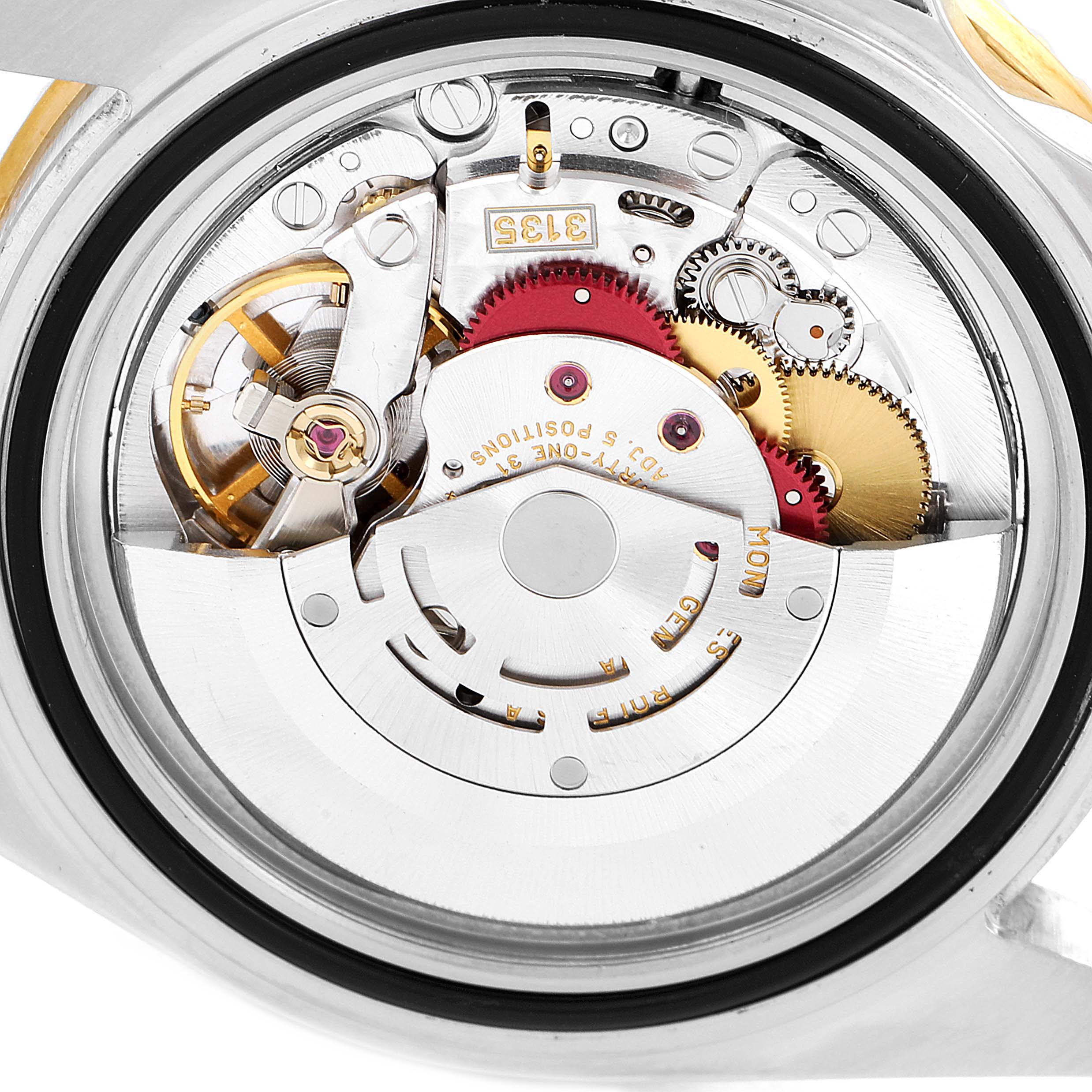 This image shows a close-up view of the movement and inner mechanisms of a Rolex Submariner 16613 Men's Steel and Gold (two tone) Black Dial 16613 Men's Steel and Gold (two tone) Black Dial watch.