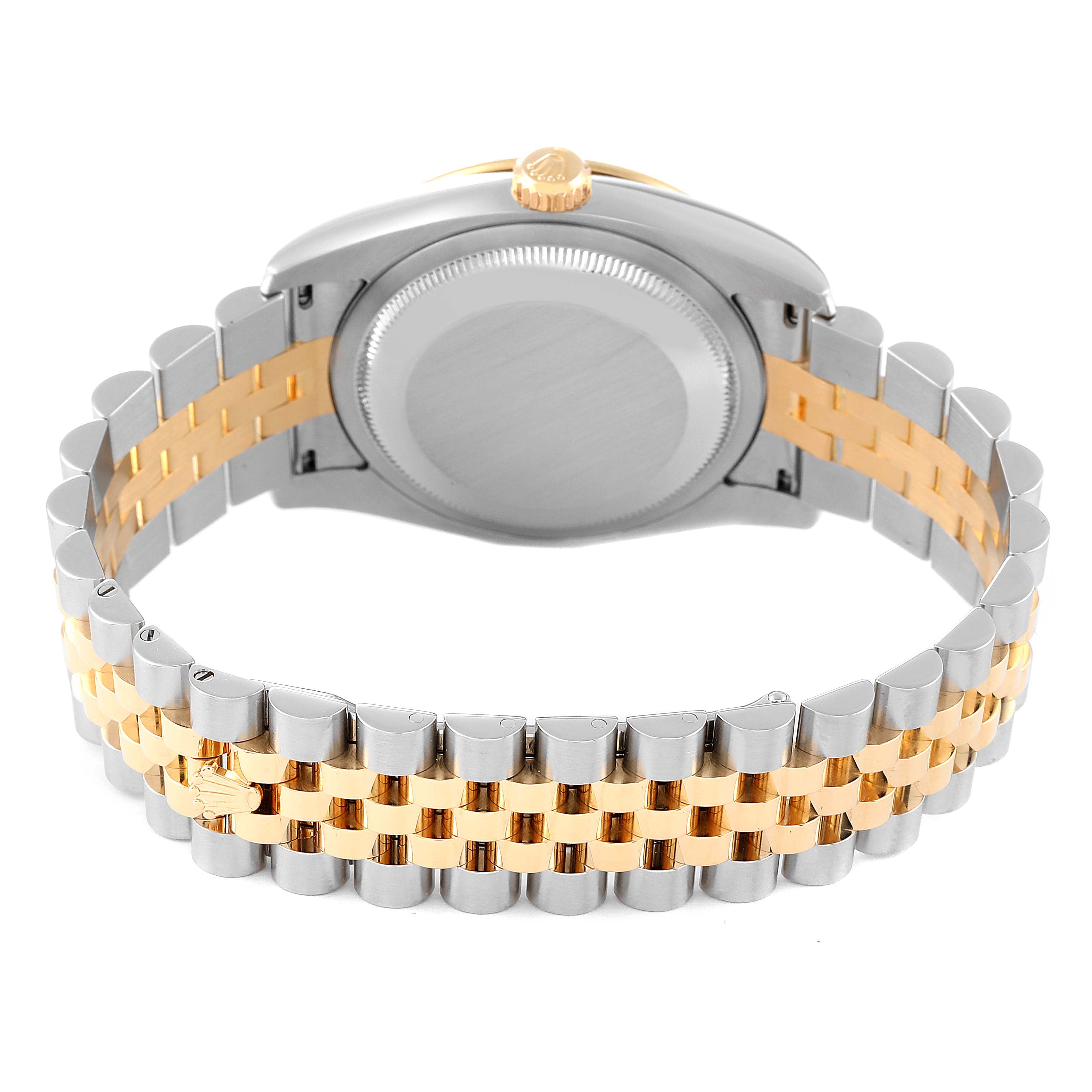 The image shows the back case and bracelet of a Rolex Turn-o-Graph 116263 Men
s Steel and Gold (two tone) Grey Dial 116263 Men
s Steel and Gold (two tone) Grey Dial watch with a two-tone silver and gold design.